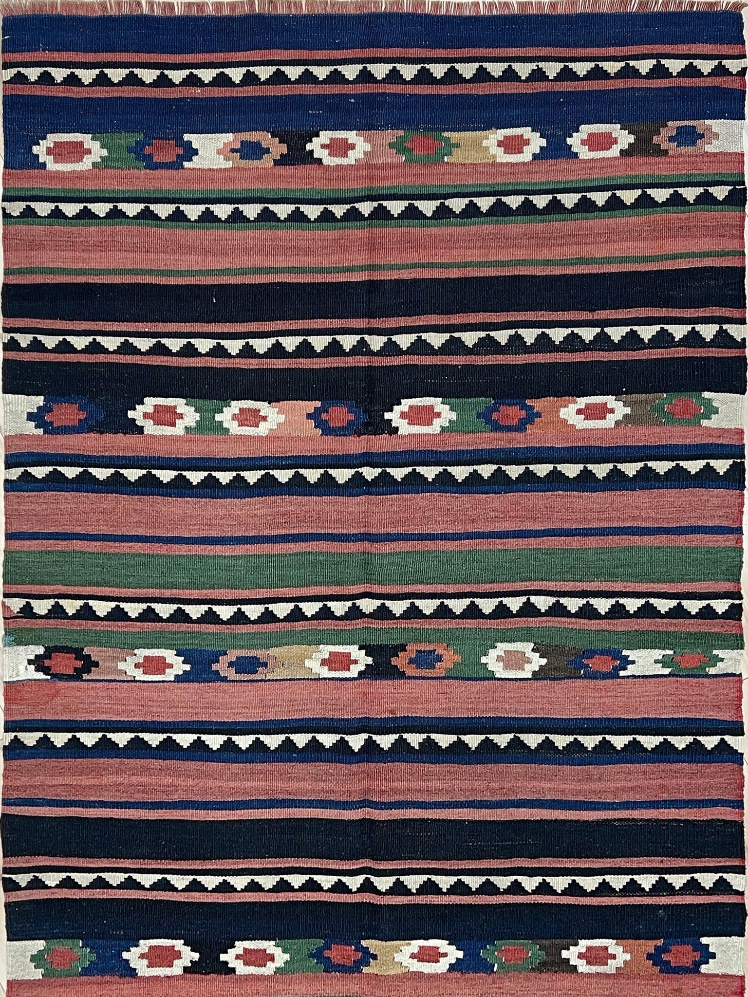 Vintage Caucasian Kilim flatweave rug with rose, green, and navy horizontal stripes and tribal motifs — handmade wool wall hanging from the 1960s, available at Indigo Rugs, the best rug shop in San Francisco Bay Area, Burlingame CA.
