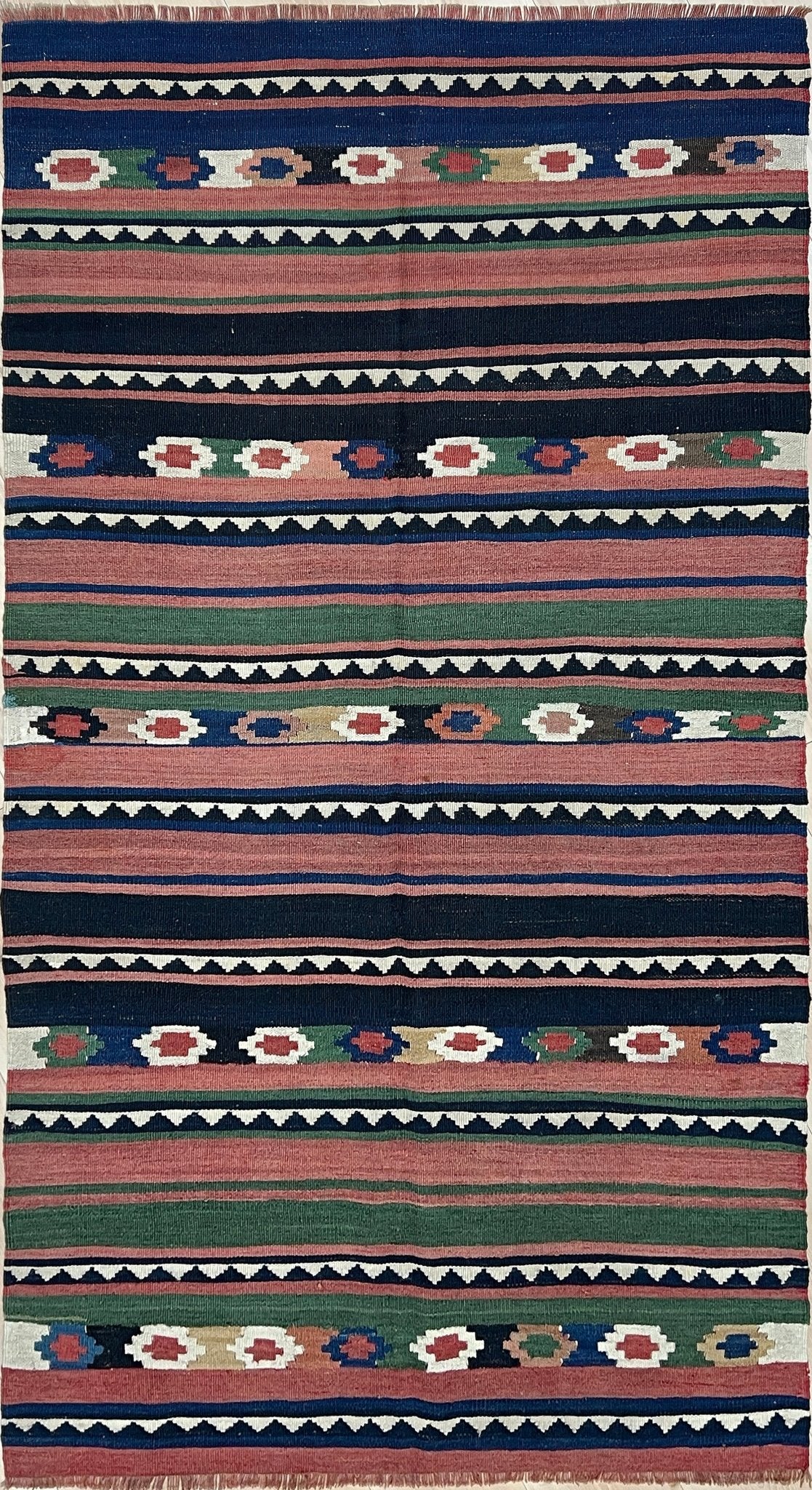 Vintage Caucasian Kilim flatweave rug with rose, green, and navy horizontal stripes and tribal motifs — handmade wool wall hanging from the 1960s, available at Indigo Rugs, the best rug shop in San Francisco Bay Area, Burlingame CA.