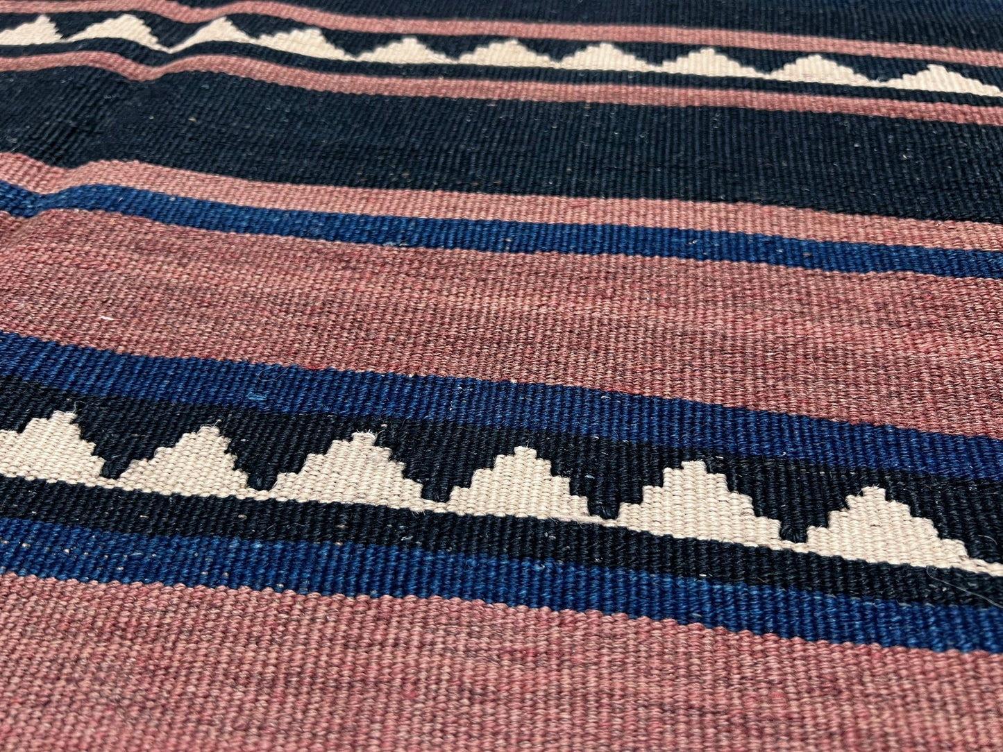 Vintage Caucasian Kilim flatweave rug with rose, green, and navy horizontal stripes and tribal motifs — handmade wool wall hanging from the 1960s, available at Indigo Rugs, the best rug shop in San Francisco Bay Area, Burlingame CA.