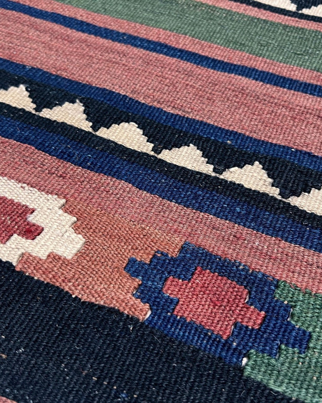 Vintage Caucasian Kilim flatweave rug with rose, green, and navy horizontal stripes and tribal motifs — handmade wool wall hanging from the 1960s, available at Indigo Rugs, the best rug shop in San Francisco Bay Area, Burlingame CA.