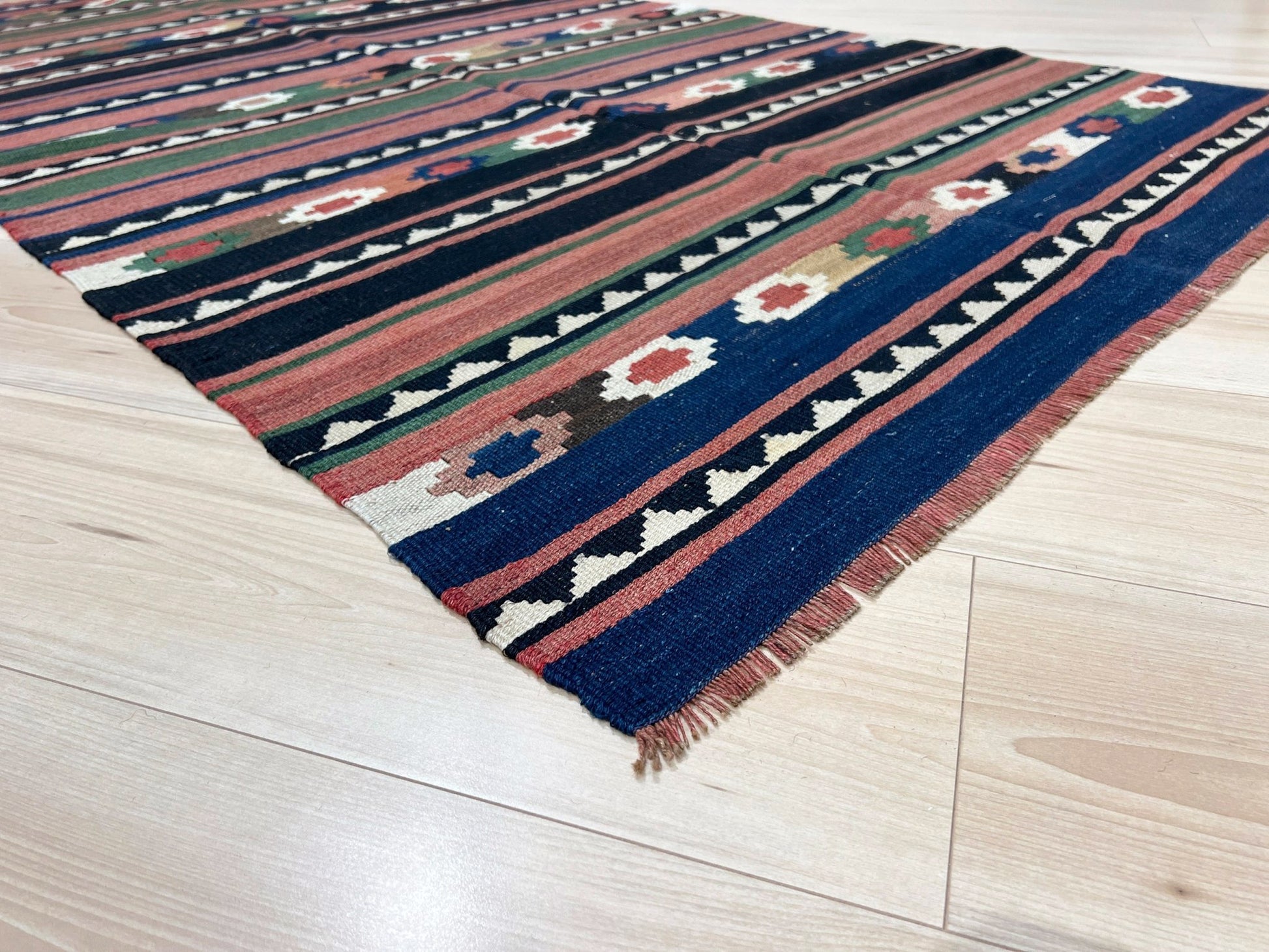 Vintage Caucasian Kilim flatweave rug with rose, green, and navy horizontal stripes and tribal motifs — handmade wool wall hanging from the 1960s, available at Indigo Rugs, the best rug shop in San Francisco Bay Area, Burlingame CA.