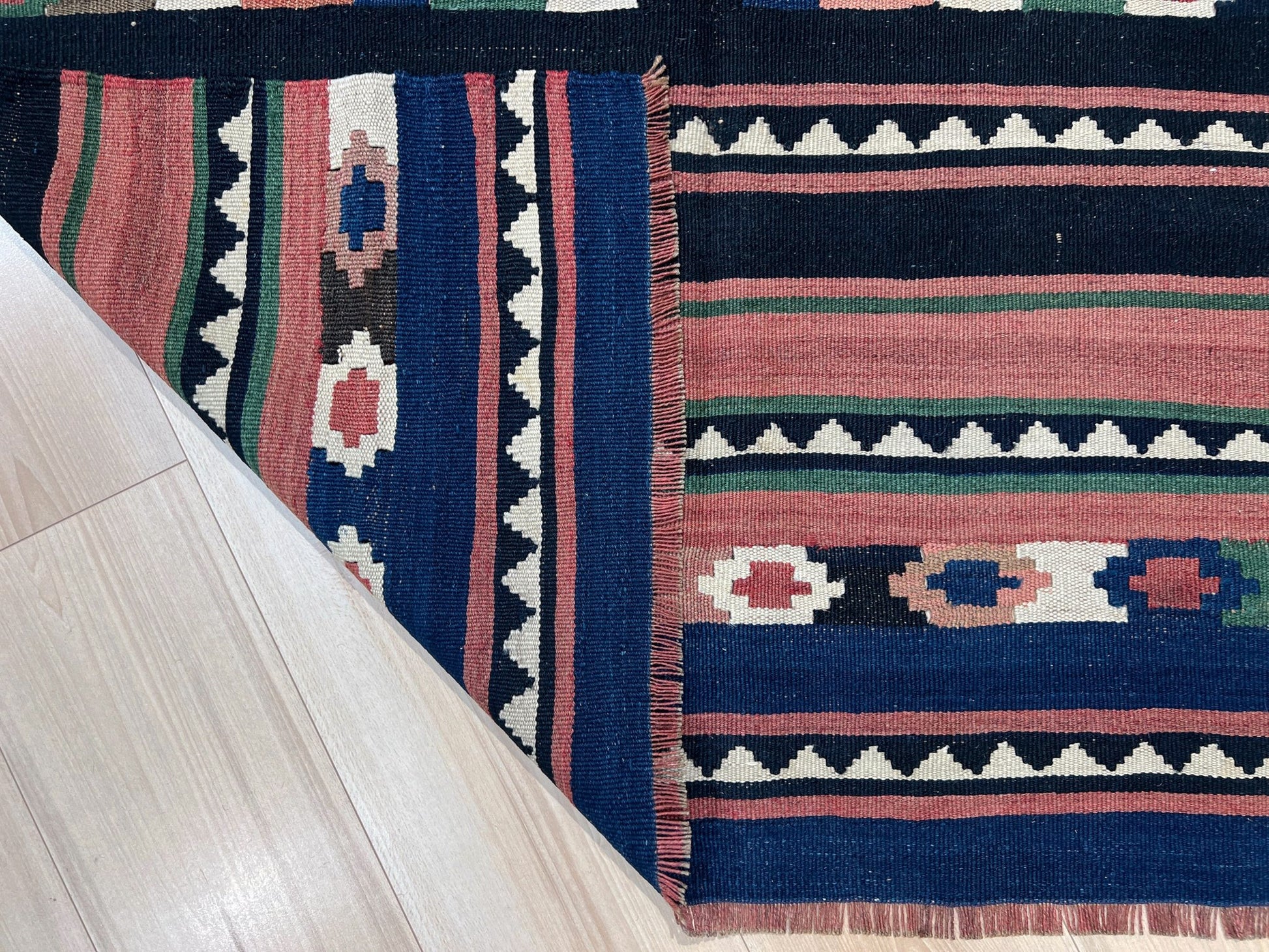 Vintage Caucasian Kilim flatweave rug with rose, green, and navy horizontal stripes and tribal motifs — handmade wool wall hanging from the 1960s, available at Indigo Rugs, the best rug shop in San Francisco Bay Area, Burlingame CA.
