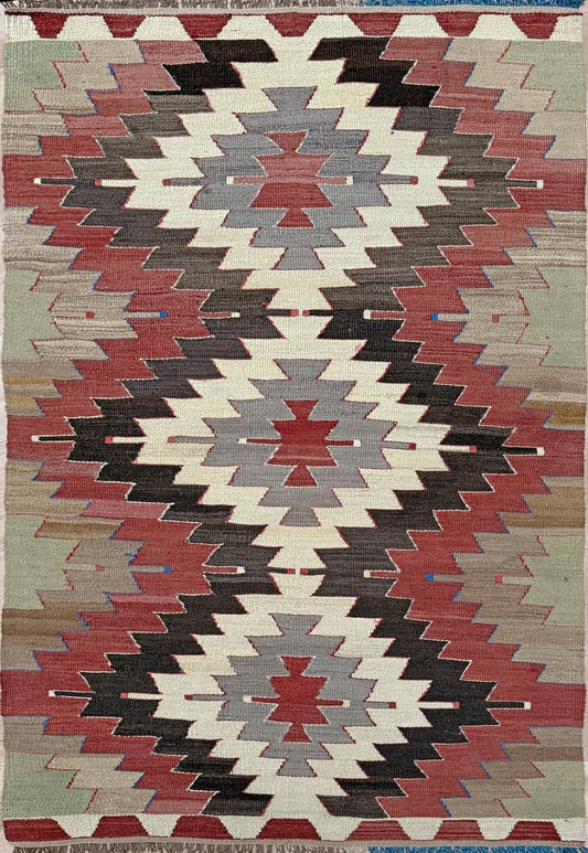 3x5 Vintage Mut kilim rug with Navajo-style stepped medallion design in clay red and charcoal — handwoven wool flatweave from 1970s Turkey, available at Indigo Rugs, Burlingame CA. Handmade rug with earth color for living room, bedroom, kitchen, study.
