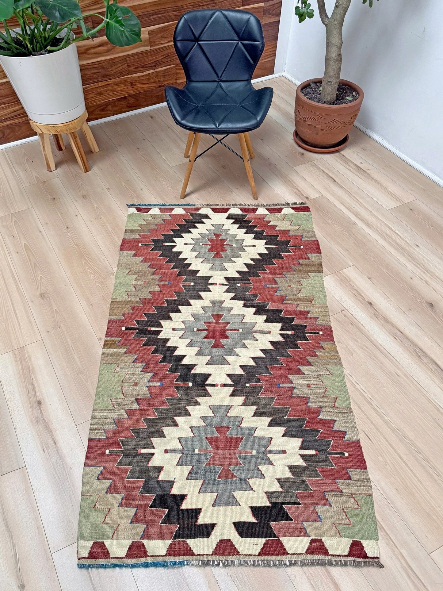 3x5 Vintage Mut kilim rug with Navajo-style stepped medallion design in clay red and charcoal — handwoven wool flatweave from 1970s Turkey, available at Indigo Rugs, Burlingame CA. Handmade rug with earth color for living room, bedroom, kitchen, study.