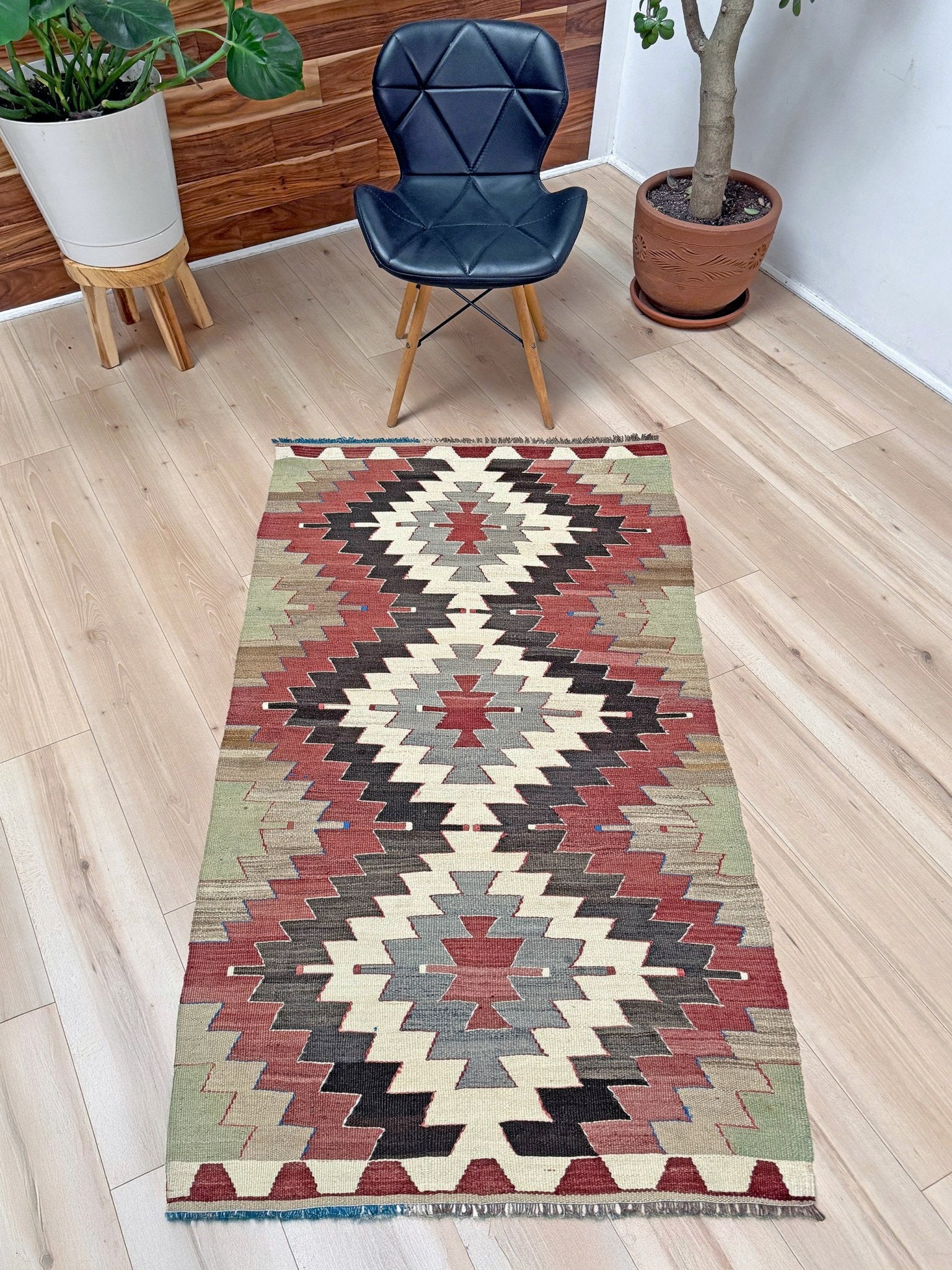 3x5 Vintage Mut kilim rug with Navajo-style stepped medallion design in clay red and charcoal — handwoven wool flatweave from 1970s Turkey, available at Indigo Rugs, Burlingame CA. Handmade rug with earth color for living room, bedroom, kitchen, study.