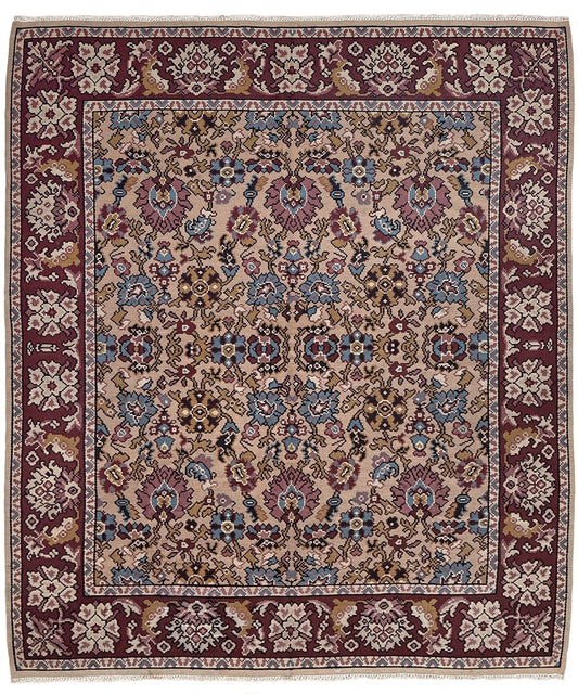 Handmade vintage Balkan floral kilim rug, approx. 8x10, with warm parchment beige field and vine-and-blossom design in dusty blue, rose, olive, and burgundy tones.