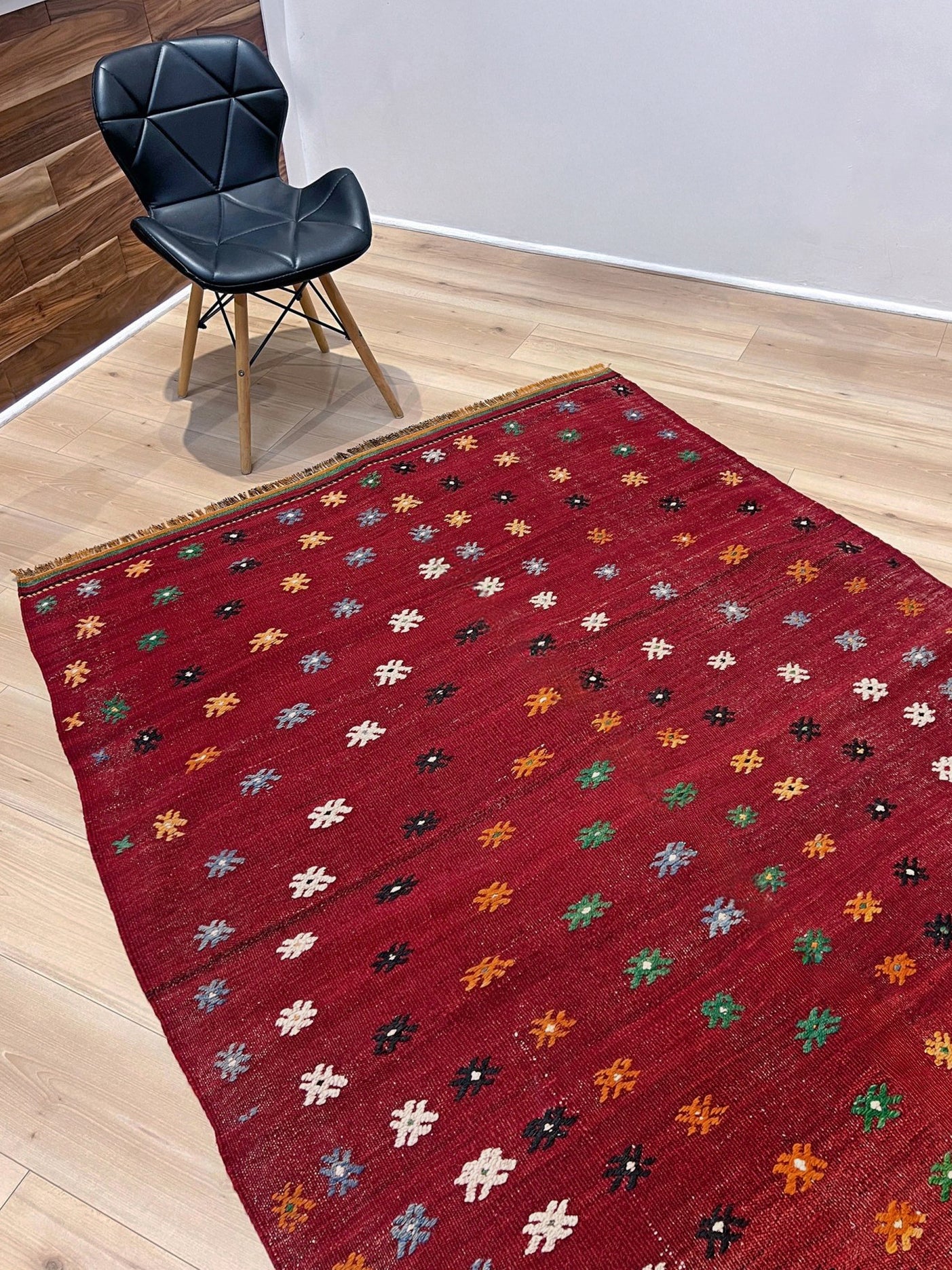 Vintage Turkish kilim rug from the Çanakkale region, handwoven wool flatweave measuring 5x7, featuring a rich brick red field with scattered geometric motifs. Authentic Anatolian tribal kilim with minimalist pattern, lightweight flat weave construction, ideal for living room, dining room, bedroom, or layered bohemian and eclectic interiors. Handmade vintage rug from Indigo Rugs, Burlingame, San Francisco Bay Area.