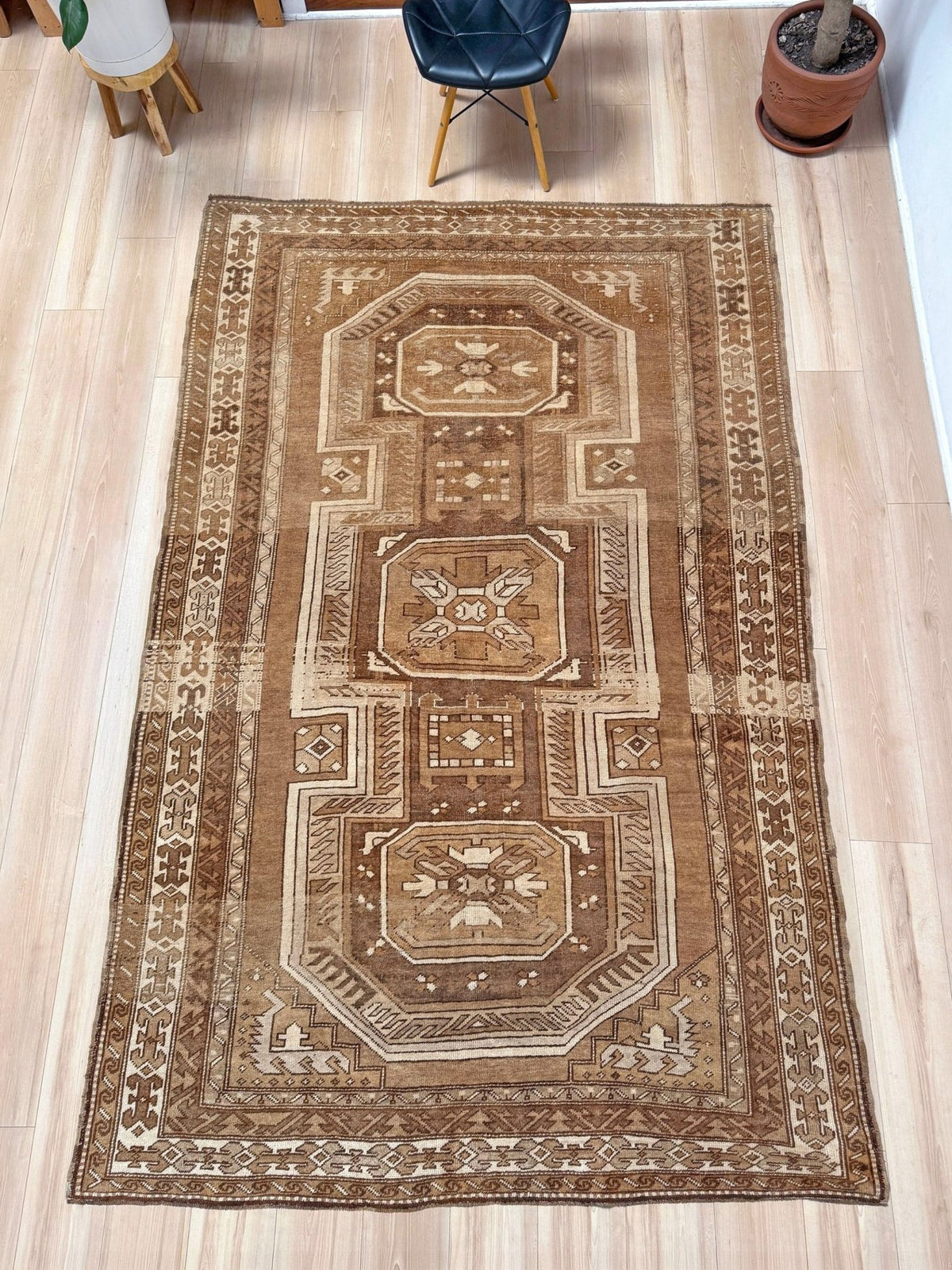 7x9 Muted brown vintage Kars Kurdish rug with three geometric medallions, stepped tribal motifs, ivory borders and naturally worn wool pile, handmade in Eastern Turkey,