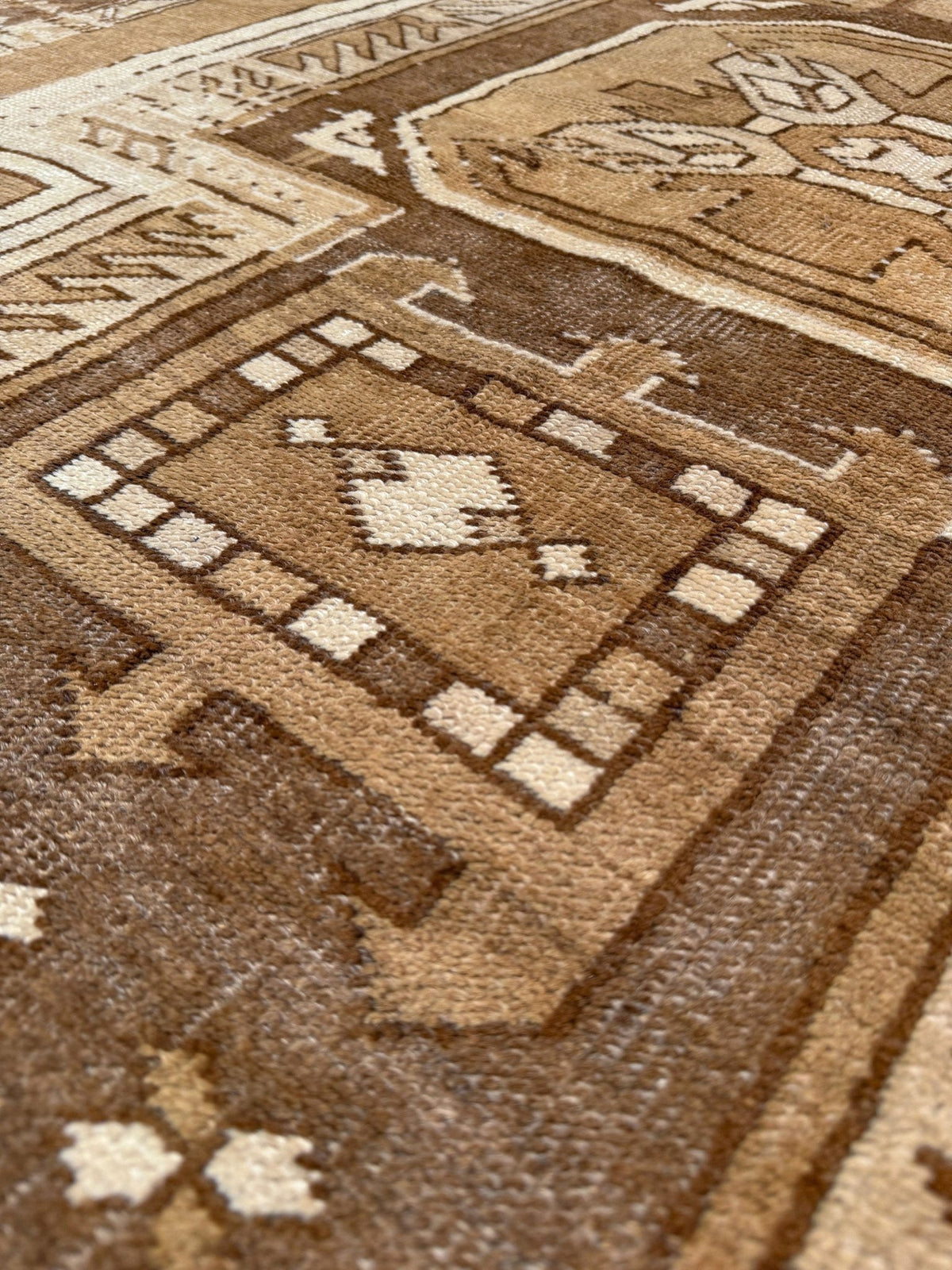 7x9 Muted brown vintage Kars Kurdish rug with three geometric medallions, stepped tribal motifs, ivory borders and naturally worn wool pile, handmade in Eastern Turkey,
