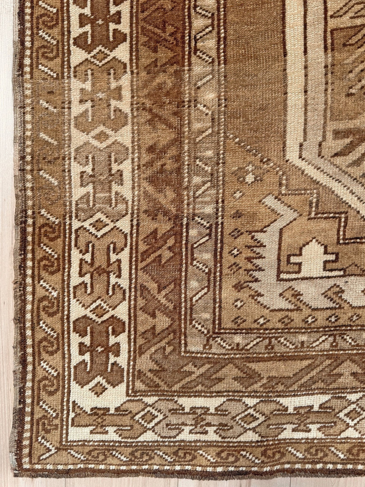 7x9 Muted brown vintage Kars Kurdish rug with three geometric medallions, stepped tribal motifs, ivory borders and naturally worn wool pile, handmade in Eastern Turkey,