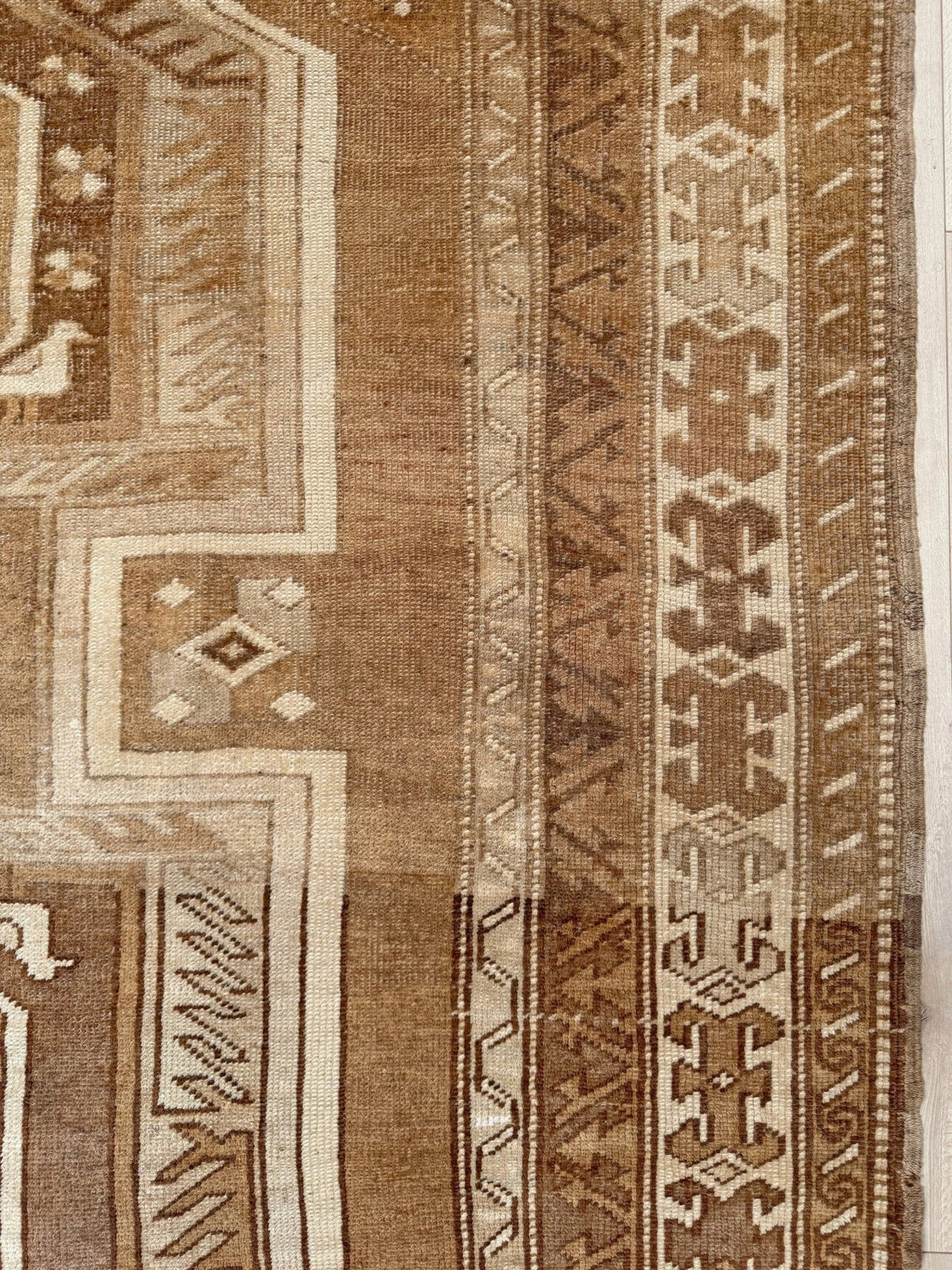 7x9 Muted brown vintage Kars Kurdish rug with three geometric medallions, stepped tribal motifs, ivory borders and naturally worn wool pile, handmade in Eastern Turkey,