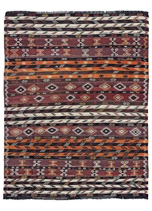 Patterned fabric with tribal design in brown, black, and white. Vintage Kars kilim rug from Eastern Turkey, 5'11" x 7'8", with horizontal tribal bands in brown, ivory, rust, and charcoal geometric motifs.