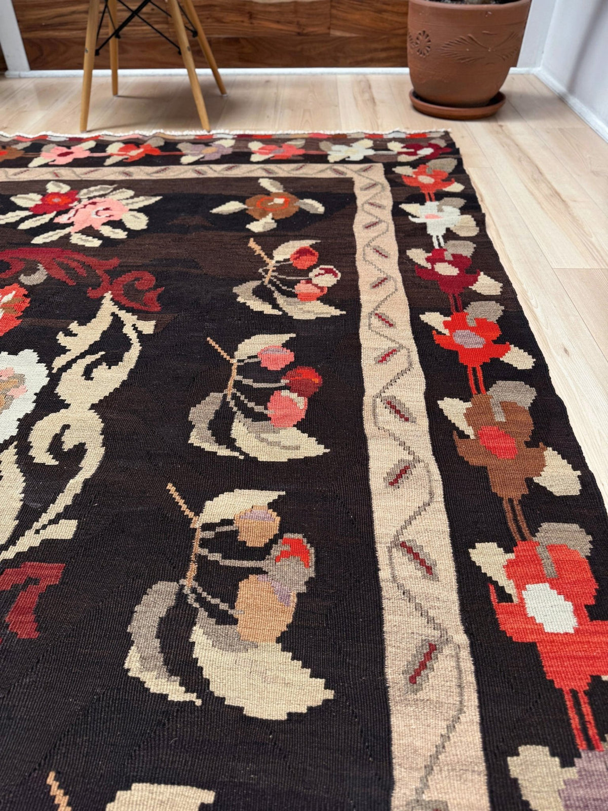 Handmade vintage Karabagh kilim wide runner rug, 6x12, with dark chocolate brown field and large floral motifs in crimson, rose, ivory, and olive tones.