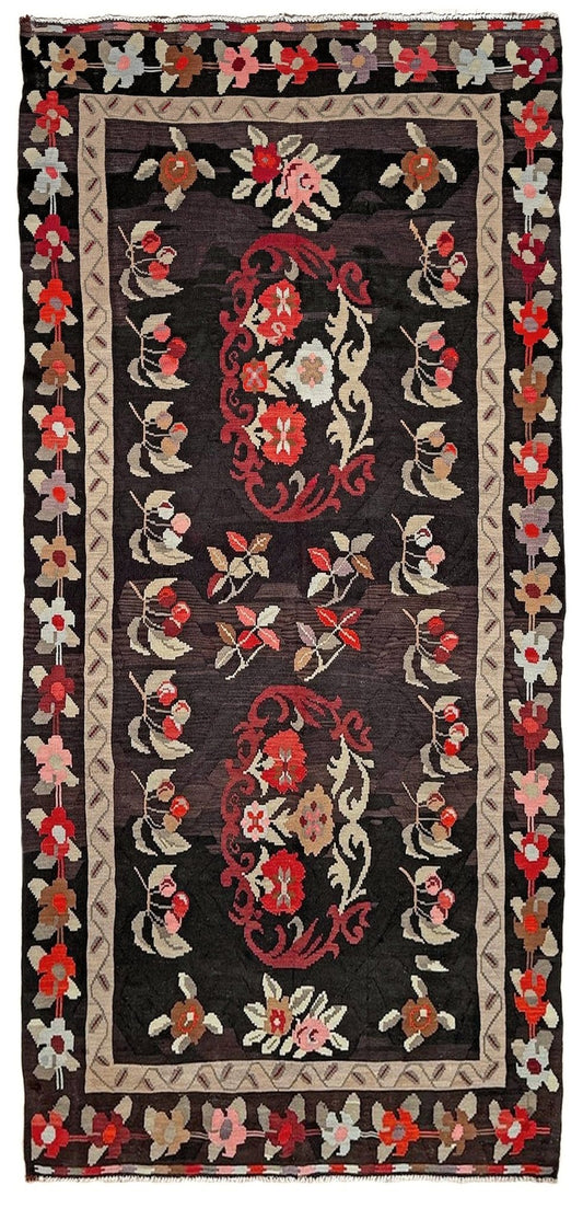 Handmade vintage Karabagh kilim wide runner rug, 6x12, with dark chocolate brown field and large floral motifs in crimson, rose, ivory, and olive tones.