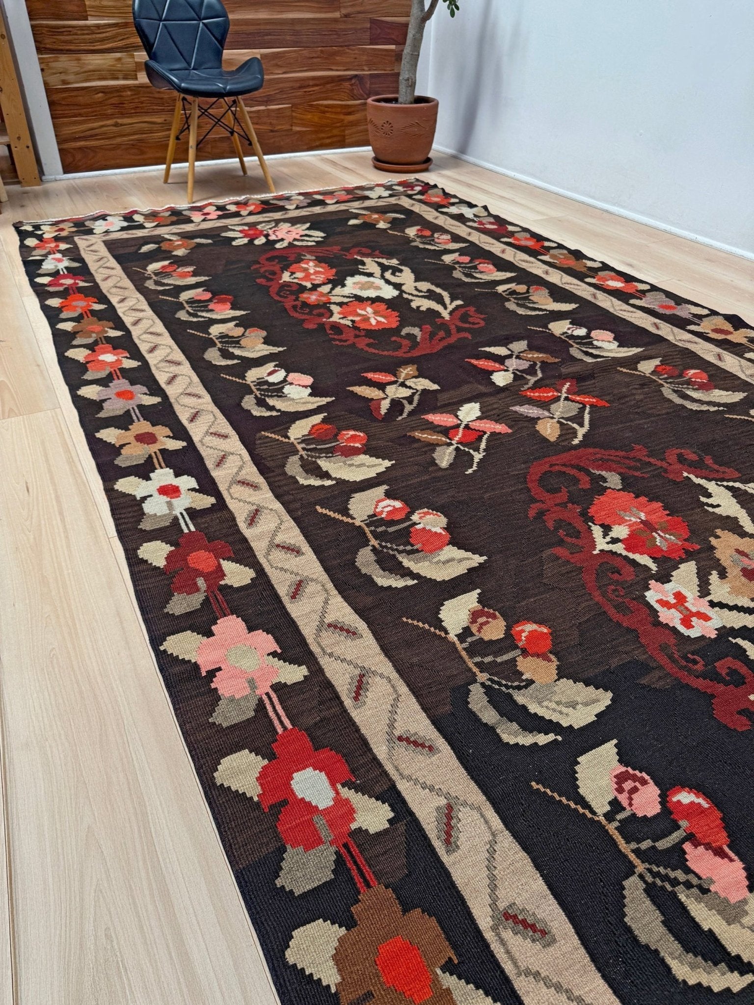 Handmade vintage Karabagh kilim wide runner rug, approx. 6x12, with dark chocolate brown field and large floral motifs in crimson, rose, ivory, and olive tones.