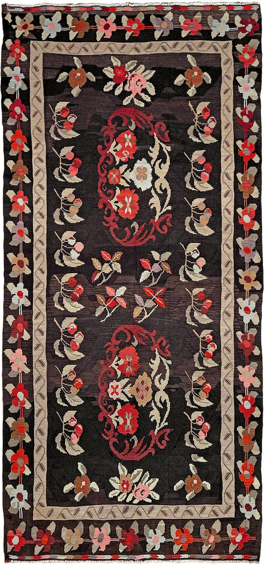Handmade vintage Karabagh kilim wide runner rug, approx. 6x12, with dark chocolate brown field and large floral motifs in crimson, rose, ivory, and olive tones.