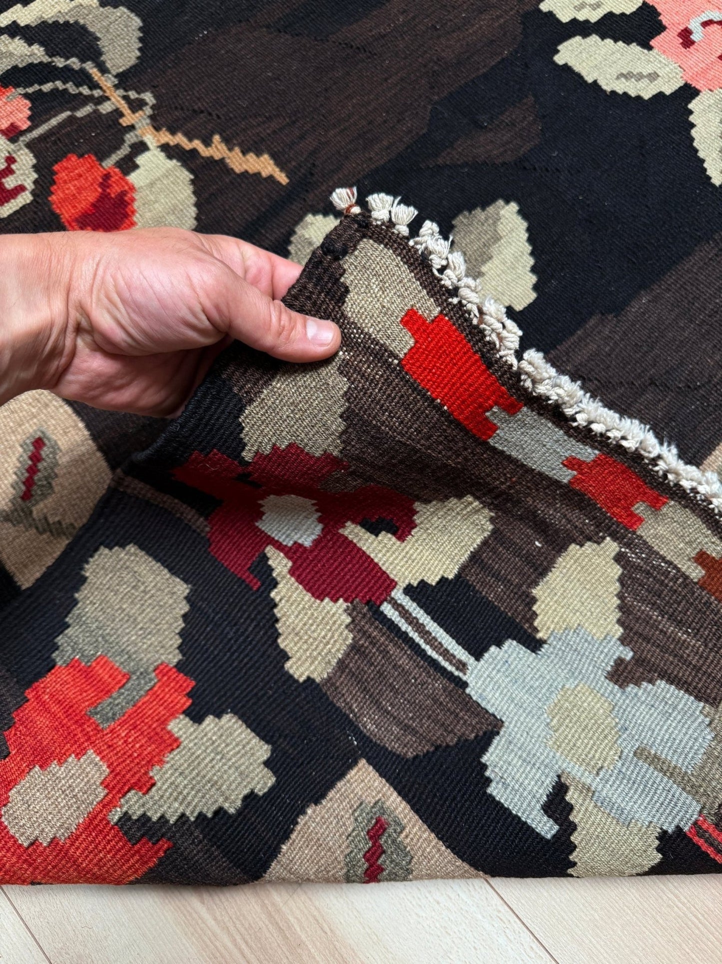 Handmade vintage Karabagh kilim wide runner rug, approx. 6x12, with dark chocolate brown field and large floral motifs in crimson, rose, ivory, and olive tones.