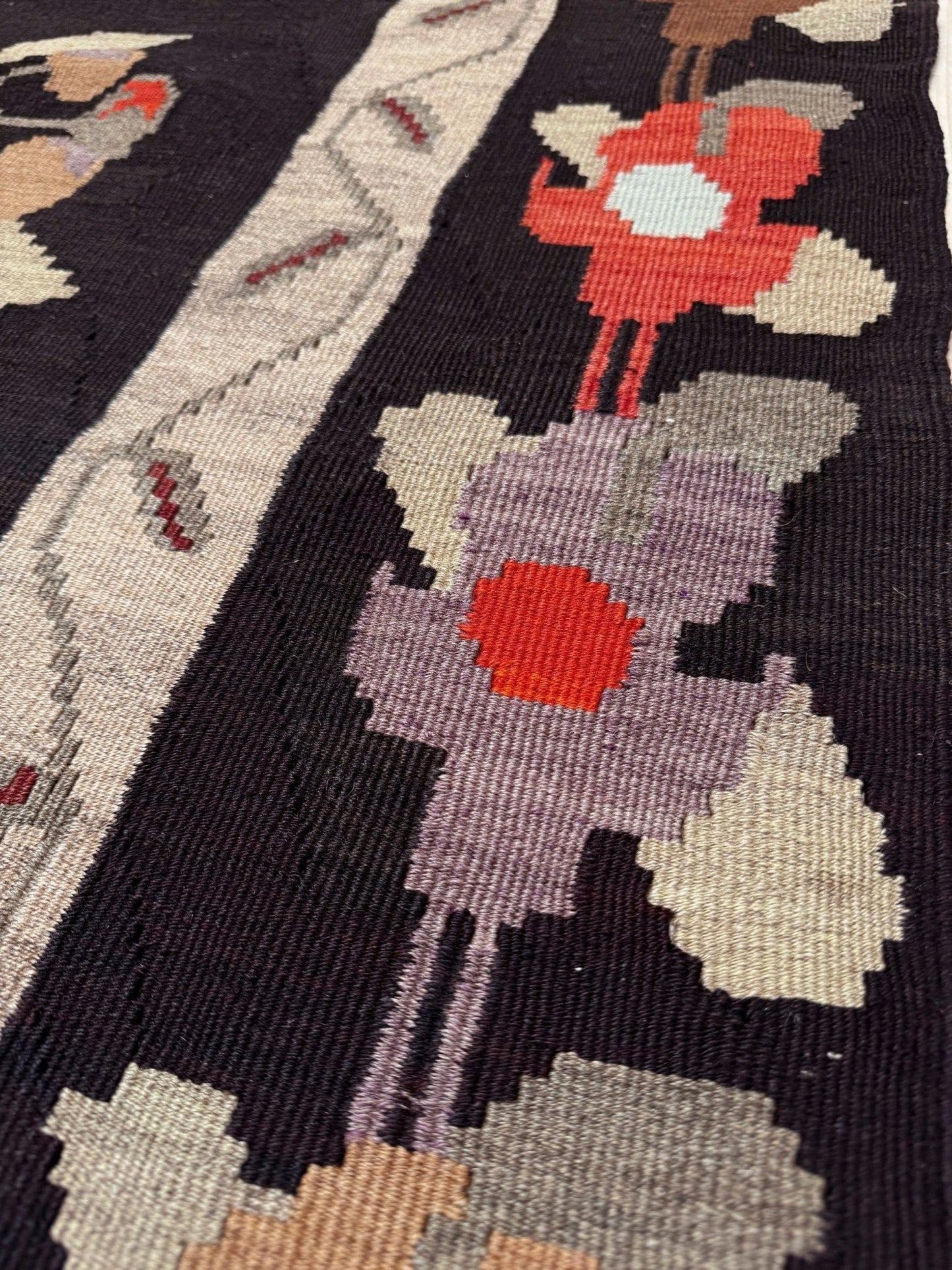 Handmade vintage Karabagh kilim wide runner rug, approx. 6x12, with dark chocolate brown field and large floral motifs in crimson, rose, ivory, and olive tones.