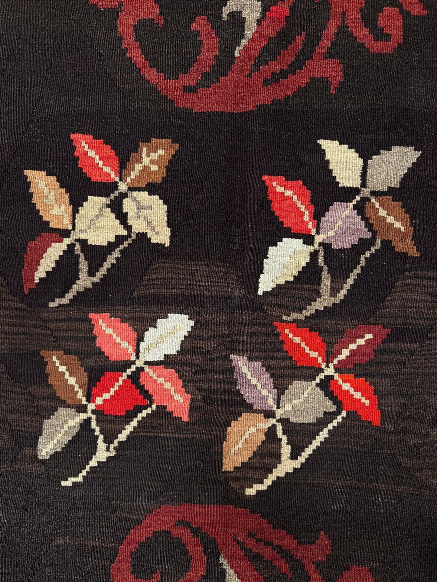 Handmade vintage Karabagh kilim wide runner rug, approx. 6x12, with dark chocolate brown field and large floral motifs in crimson, rose, ivory, and olive tones.