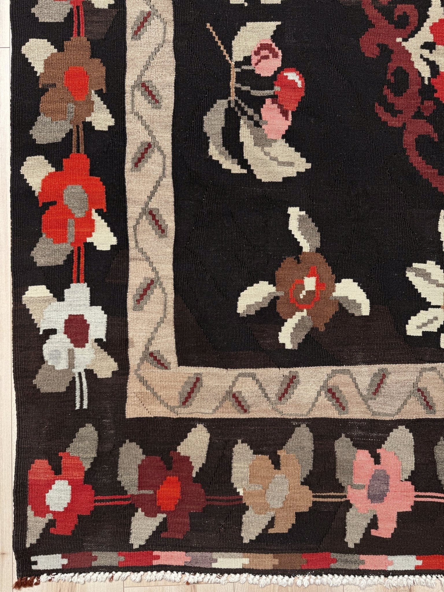 Handmade vintage Karabagh kilim wide runner rug, approx. 6x12, with dark chocolate brown field and large floral motifs in crimson, rose, ivory, and olive tones.