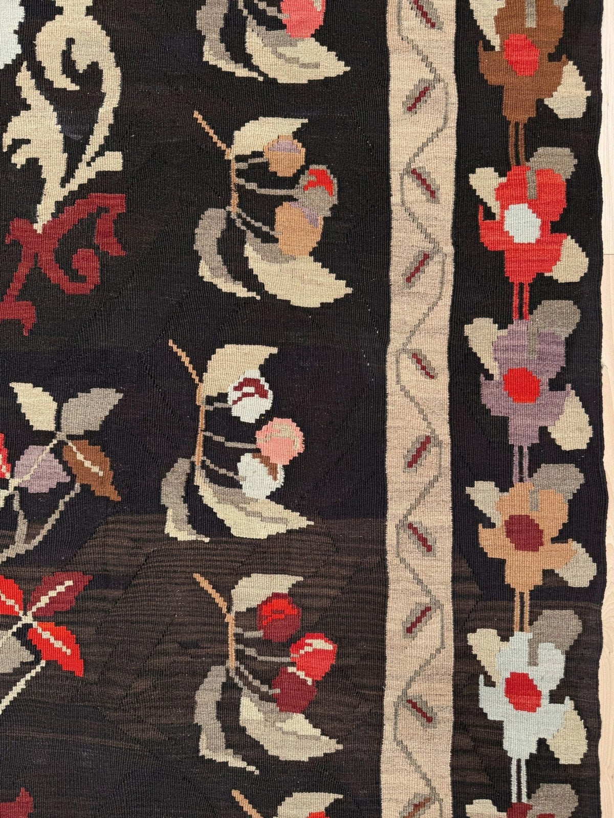 Handmade vintage Karabagh kilim wide runner rug, approx. 6x12, with dark chocolate brown field and large floral motifs in crimson, rose, ivory, and olive tones.