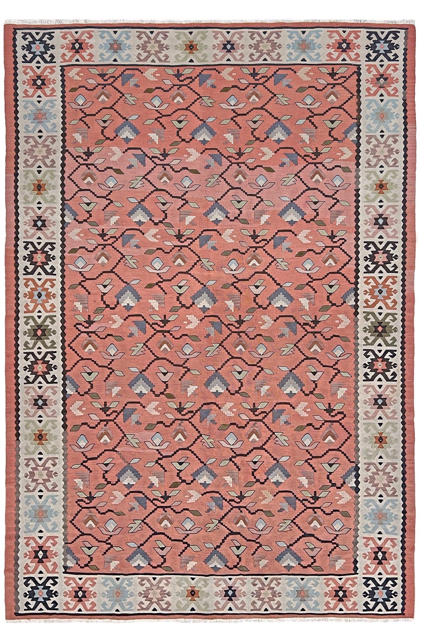 Vintage Balkan Pirot Sharkoy kilim rug, 5x8 with faded geometric floral motifs in dusty coral pink, ivory, sage, and soft blue tones with natural abrash.