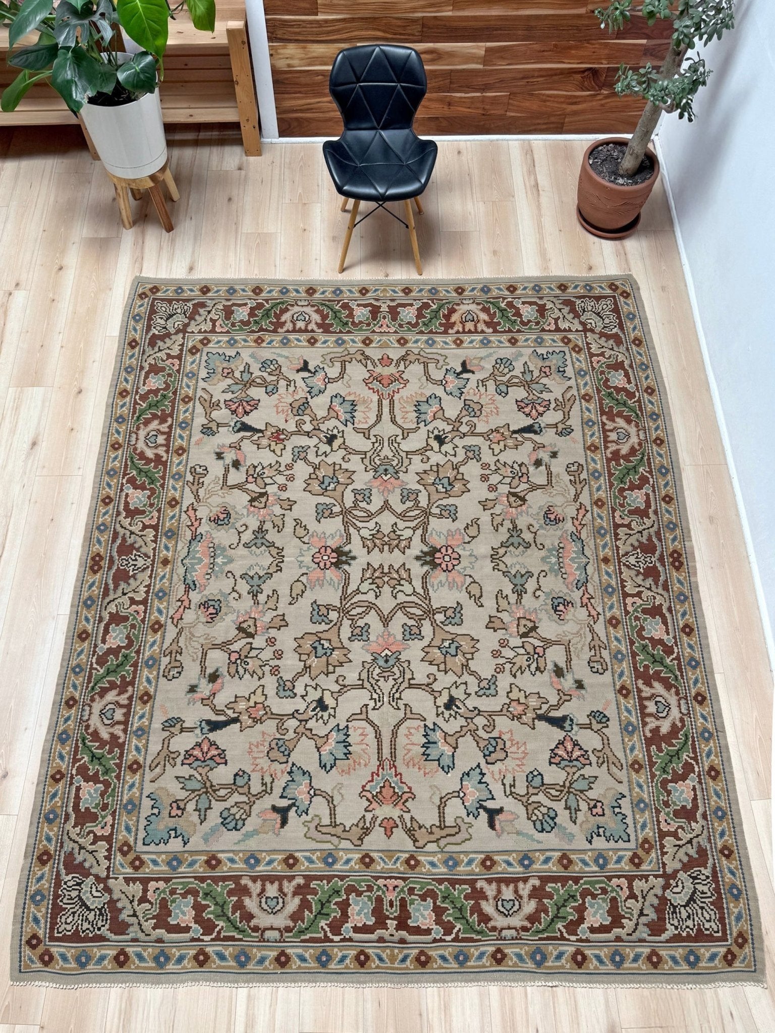 Handmade square 8x9 vintage Balkan floral kilim flatweave rug with light parchment field and vine-and-blossom design in dusty blue, rose, and sage tones.