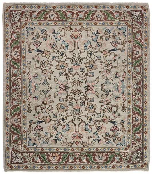 Handmade square 8x9 vintage Balkan floral kilim flatweave rug with light parchment field and vine-and-blossom design in dusty blue, rose, and sage tones.