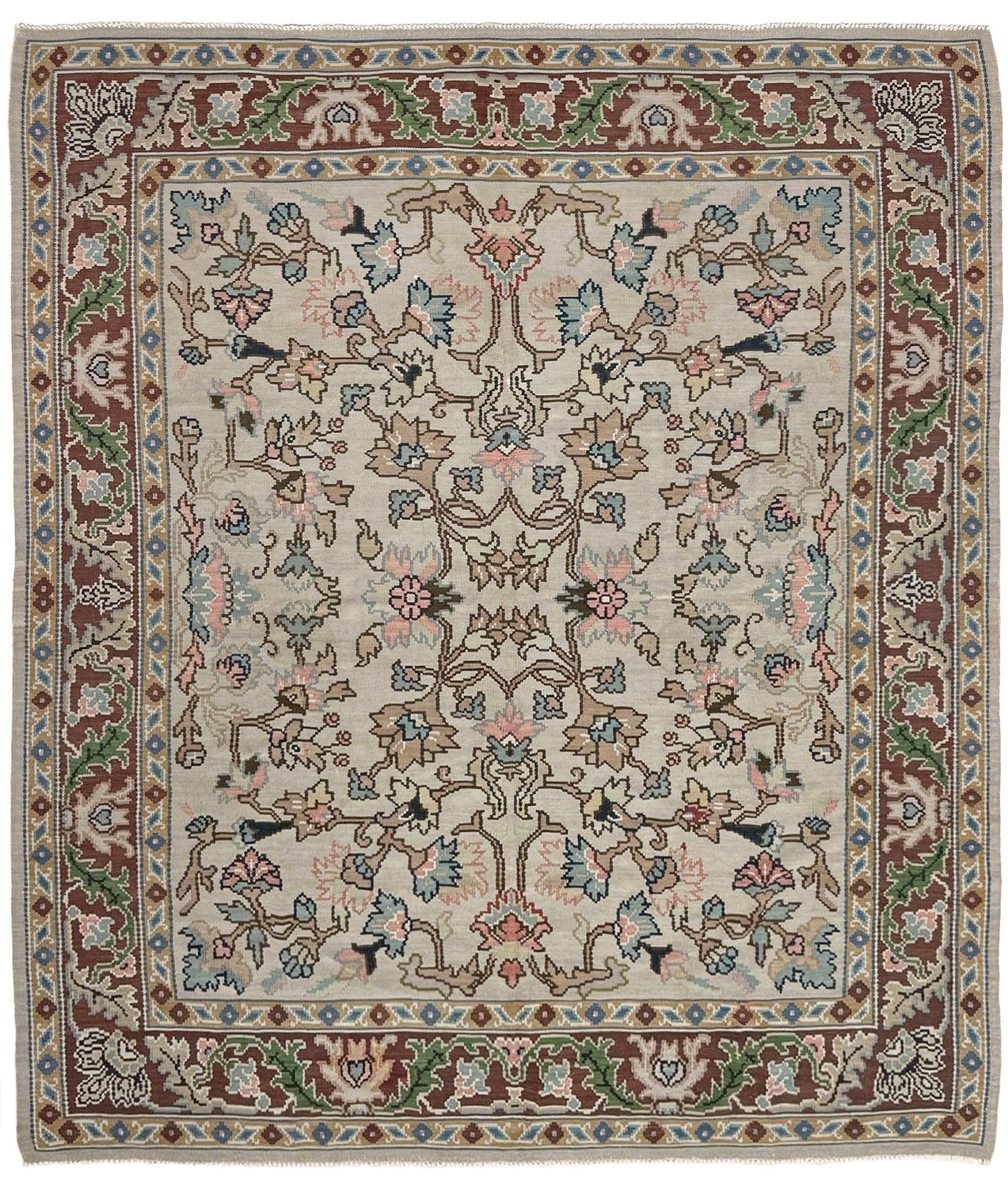 Handmade square 8x9 vintage Balkan floral kilim flatweave rug with light parchment field and vine-and-blossom design in dusty blue, rose, and sage tones.
