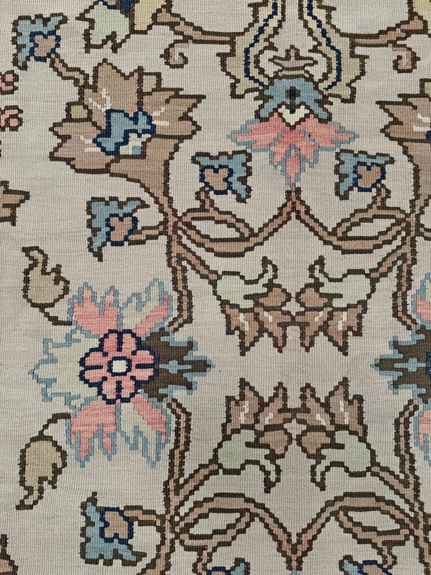 Handmade square 8x9 vintage Balkan floral kilim flatweave rug with light parchment field and vine-and-blossom design in dusty blue, rose, and sage tones.