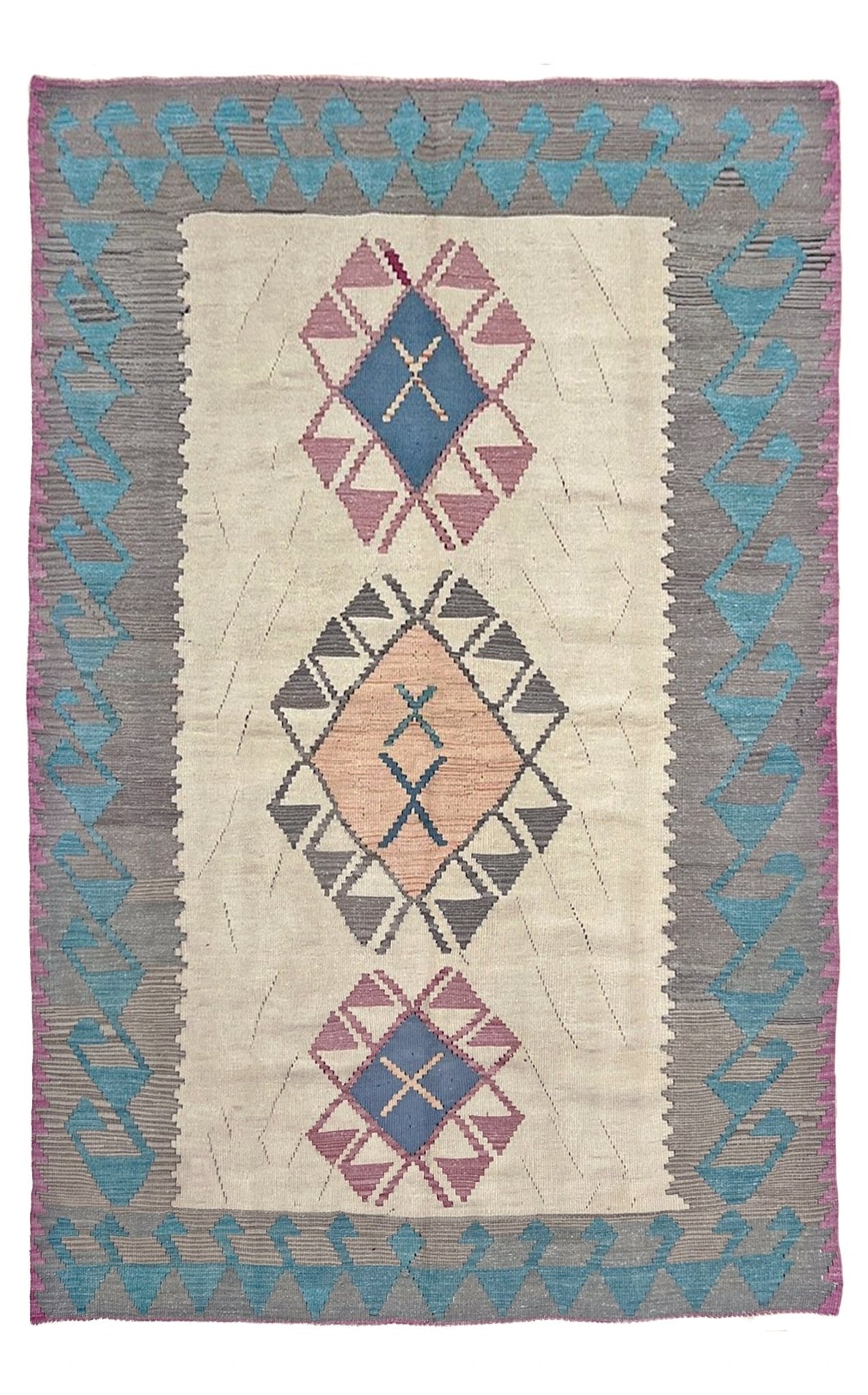 Woven rug with geometric pattern on a plain background. Decorative rug with geometric pattern featuring diamonds and cross symbols on a white background. Vintage Turkish kilim rug, 5x7. 