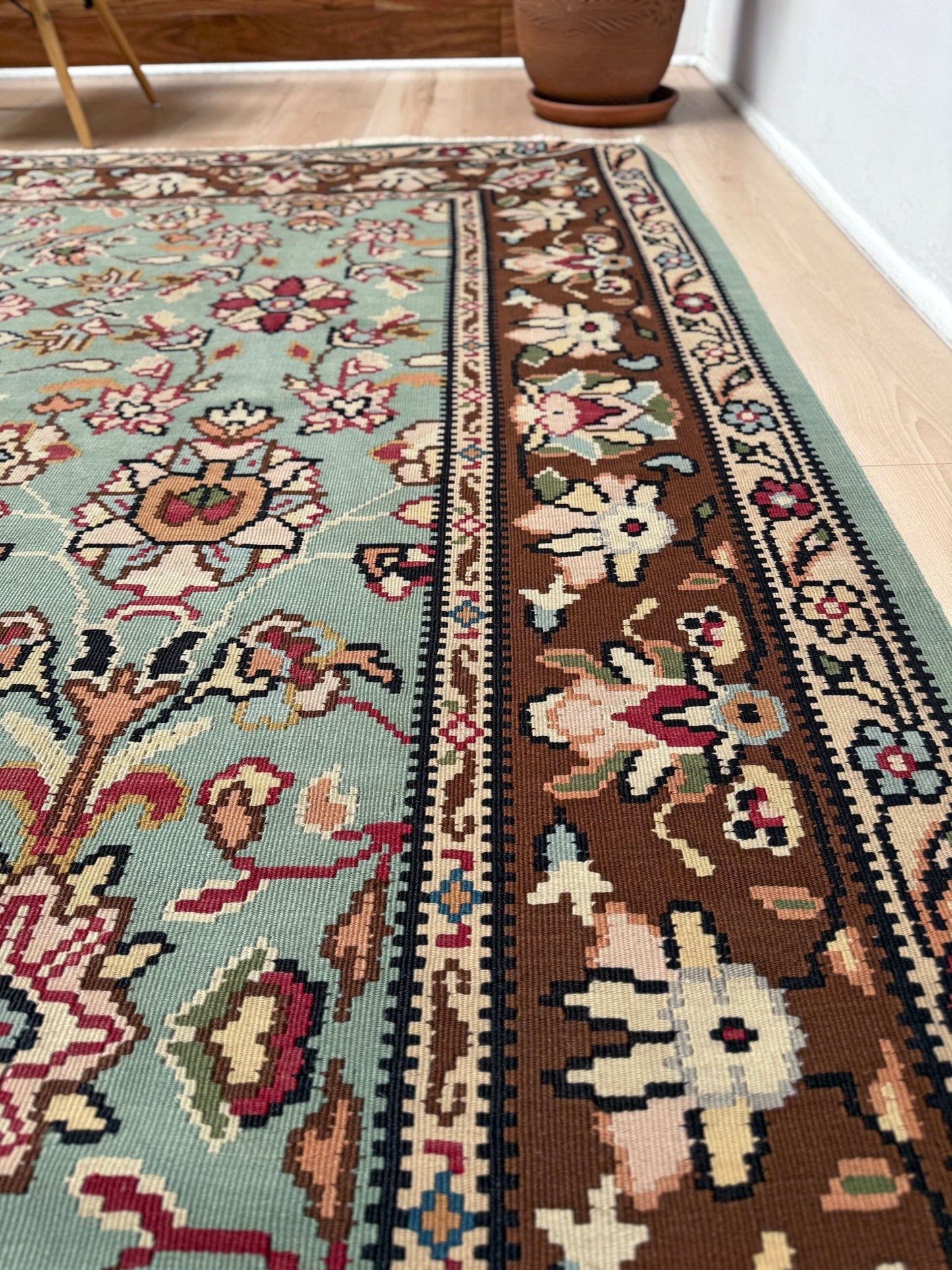 Handmade vintage European kilim rug 8x11 with floral design in robin’s egg blue, chestnut, ivory, and magenta tones; perfect for dining room, living room, bedroom, or kitchen; ideal for boho or floral decor; available at the best rug shop in San Mateo, SF Bay Area with free shipping.