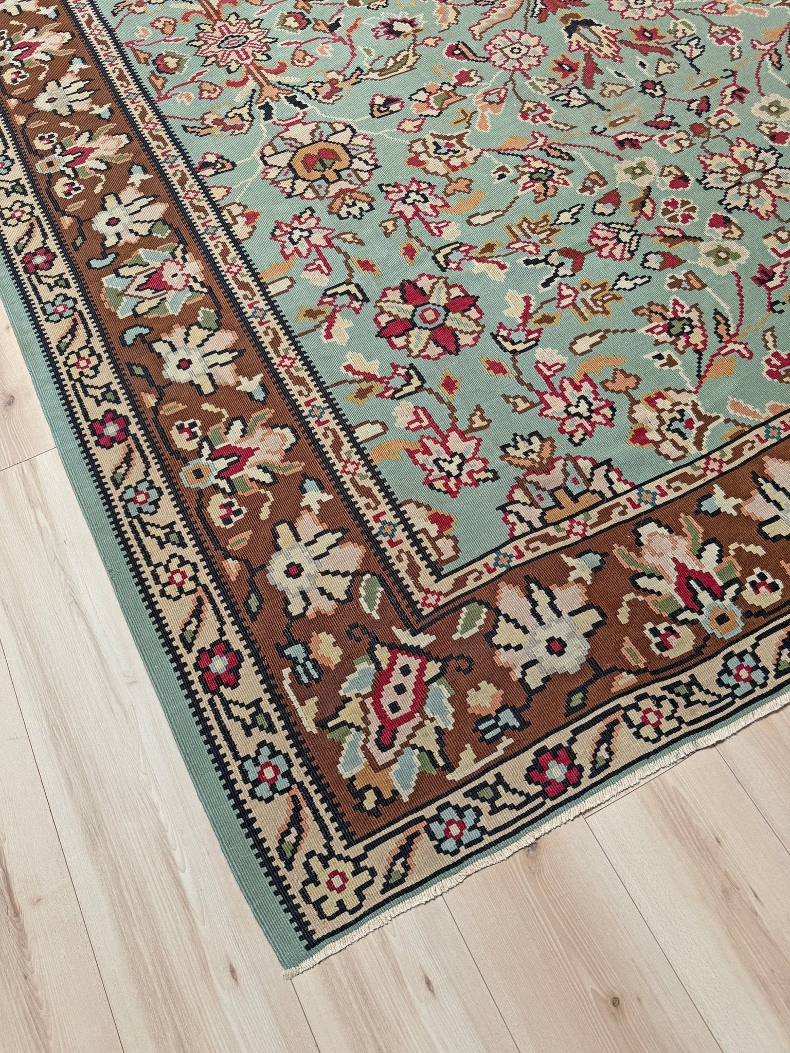 Handmade vintage European kilim rug 8x11 with floral design in robin’s egg blue, chestnut, ivory, and magenta tones; perfect for dining room, living room, bedroom, or kitchen; ideal for boho or floral decor; available at the best rug shop in San Mateo, SF Bay Area with free shipping.