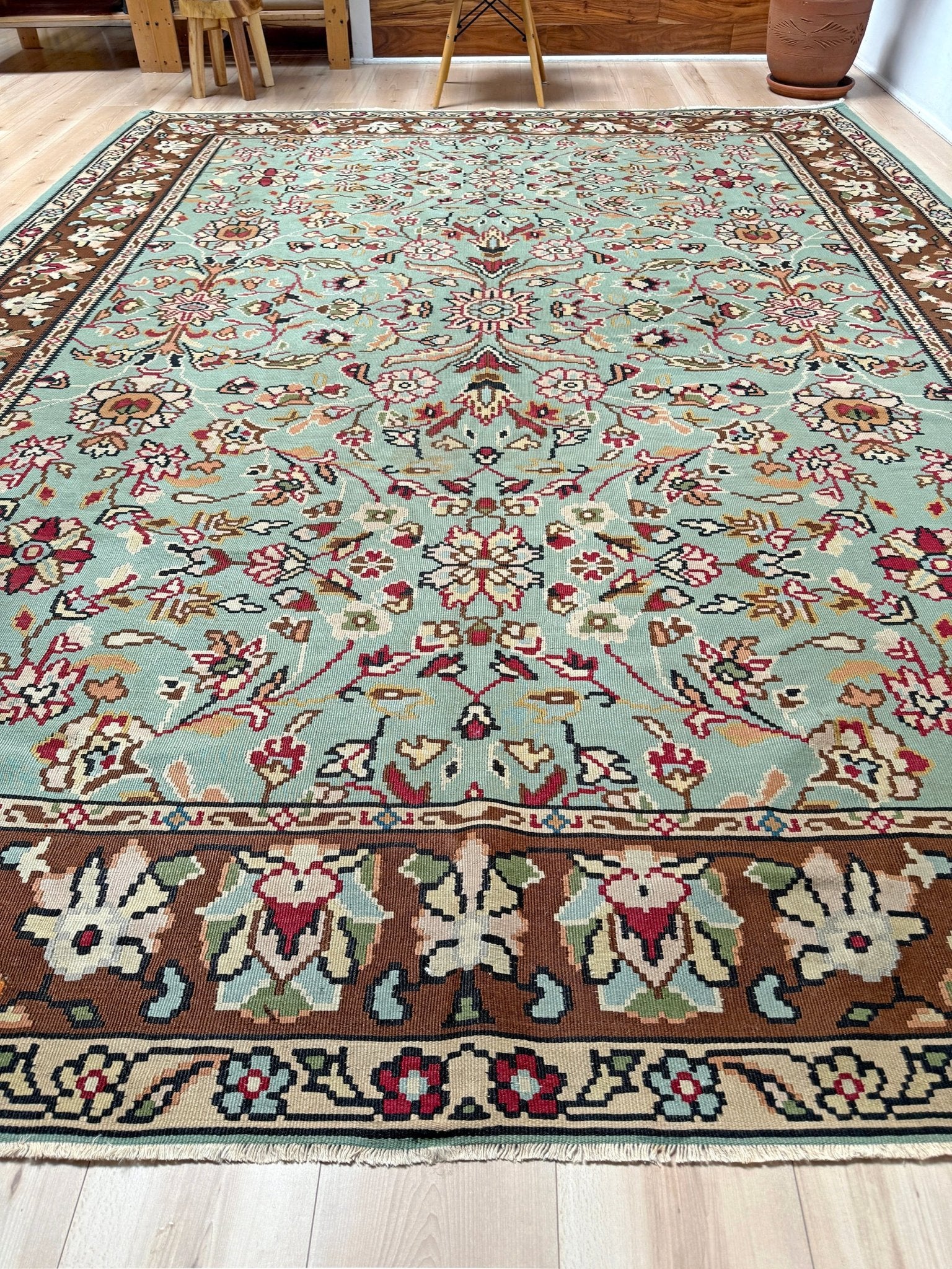 Handmade vintage European kilim rug 8x11 with floral design in robin’s egg blue, chestnut, ivory, and magenta tones; perfect for dining room, living room, bedroom, or kitchen; ideal for boho or floral decor; available at the best rug shop in San Mateo, SF Bay Area with free shipping.