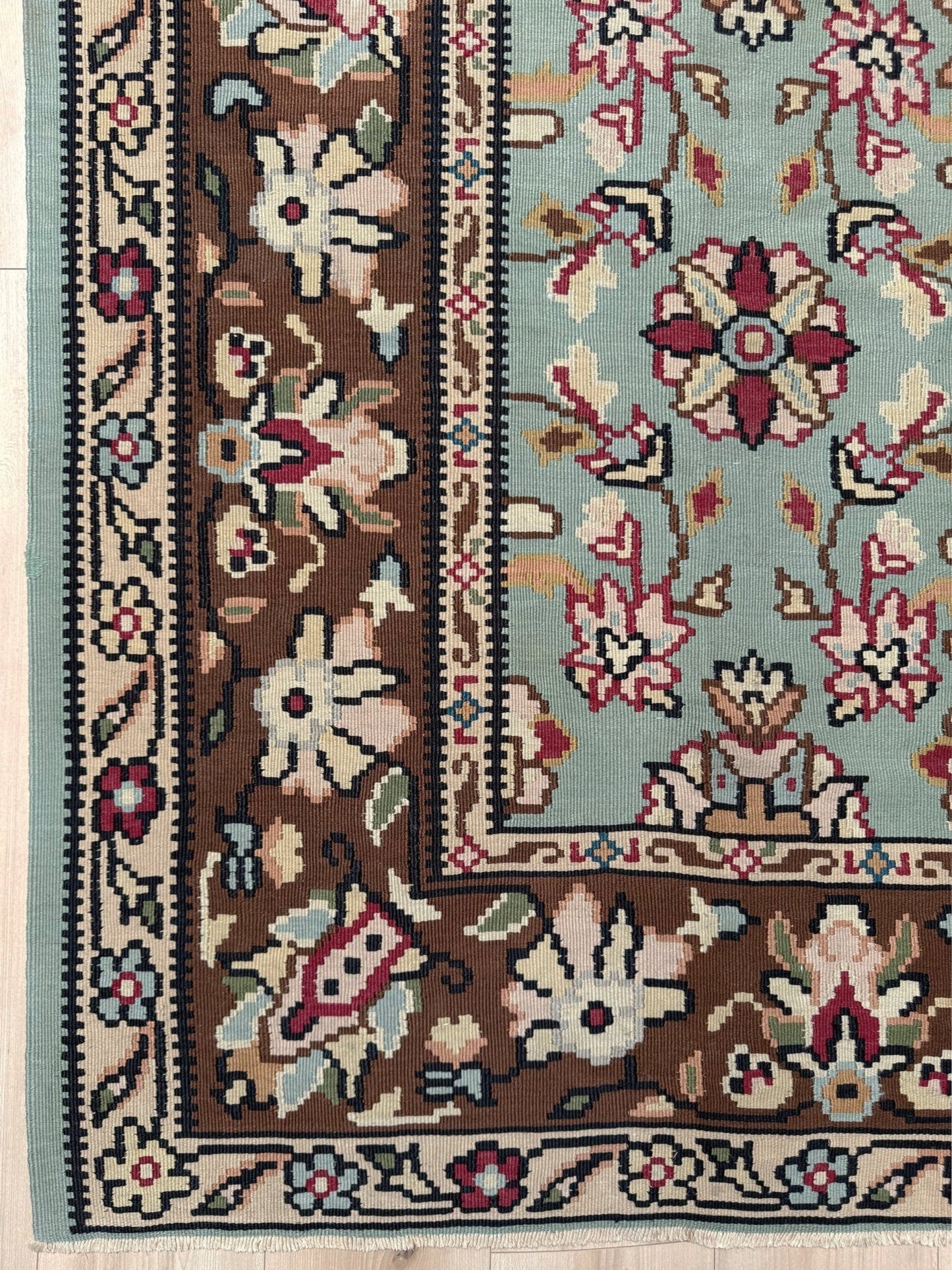 Vintage European kilim with pale seafoam green field and floral design, handwoven wool flatweave rug with walnut brown border, approx. 8x11.