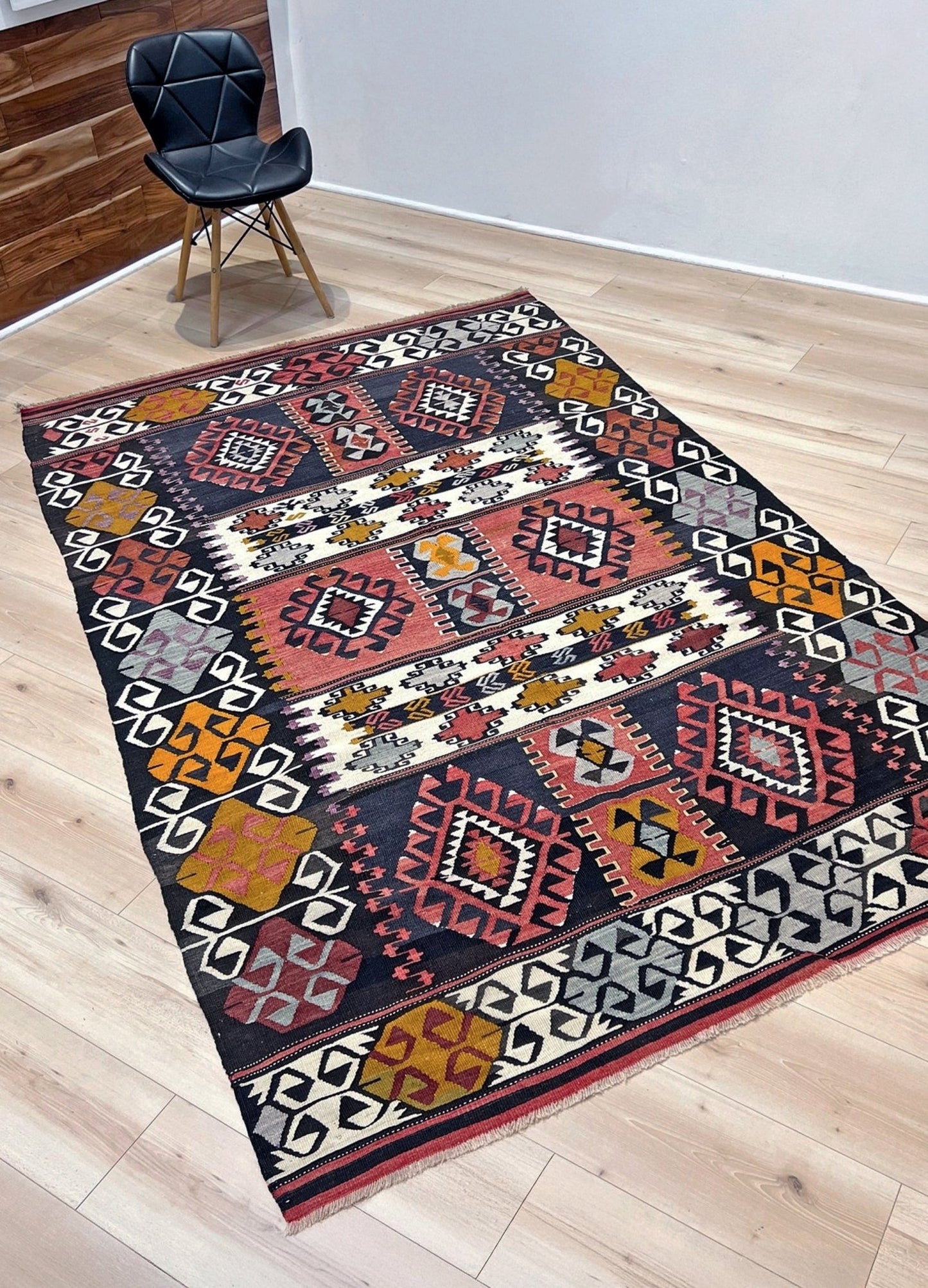 6x8 Vintage Karakecili Turkish kilim rug with bold tribal geometric motifs in charcoal, coral red, ivory, mustard, and soft gray, handwoven flatweave from the 1950s. 