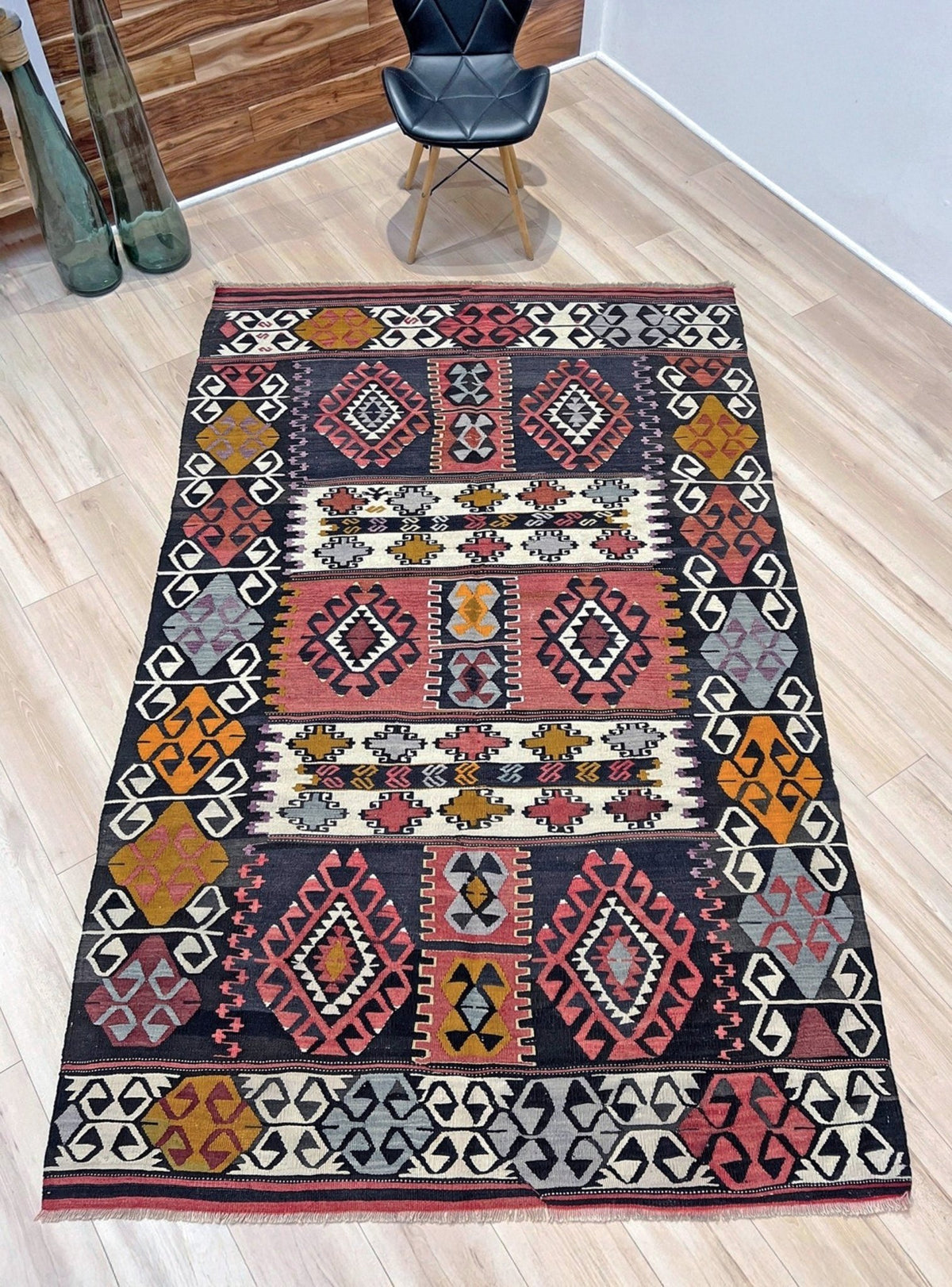 6x8 Vintage Karakecili Turkish kilim rug with bold tribal geometric motifs in charcoal, coral red, ivory, mustard, and soft gray, handwoven flatweave from the 1950s. 