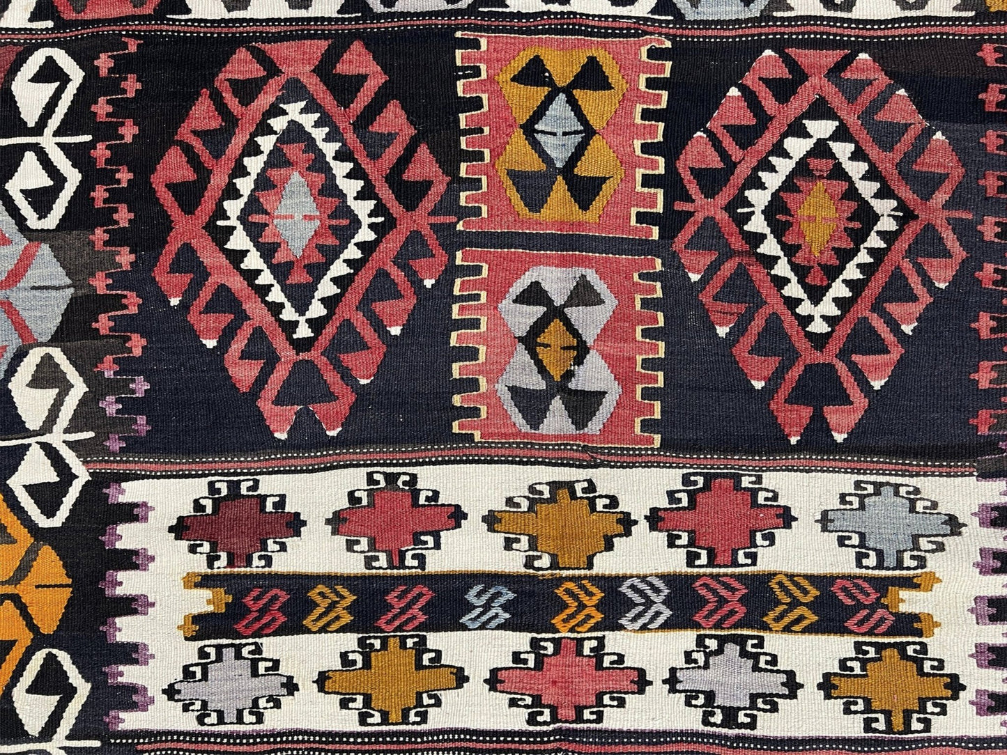 6x8 Vintage Karakecili Turkish kilim rug with bold tribal geometric motifs in charcoal, coral red, ivory, mustard, and soft gray, handwoven flatweave from the 1950s. 
