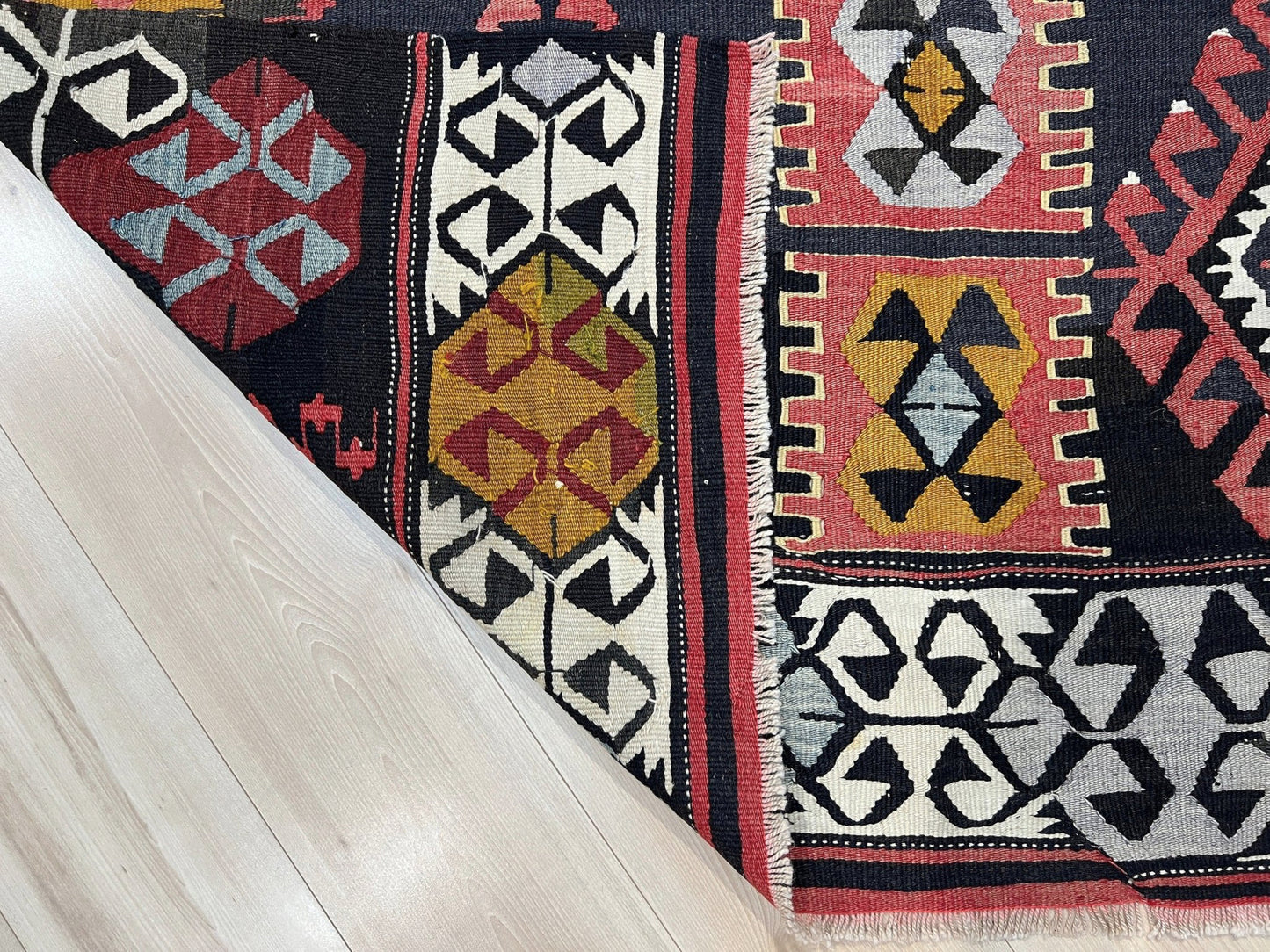 6x8 Vintage Karakecili Turkish kilim rug with bold tribal geometric motifs in charcoal, coral red, ivory, mustard, and soft gray, handwoven flatweave from the 1950s. 