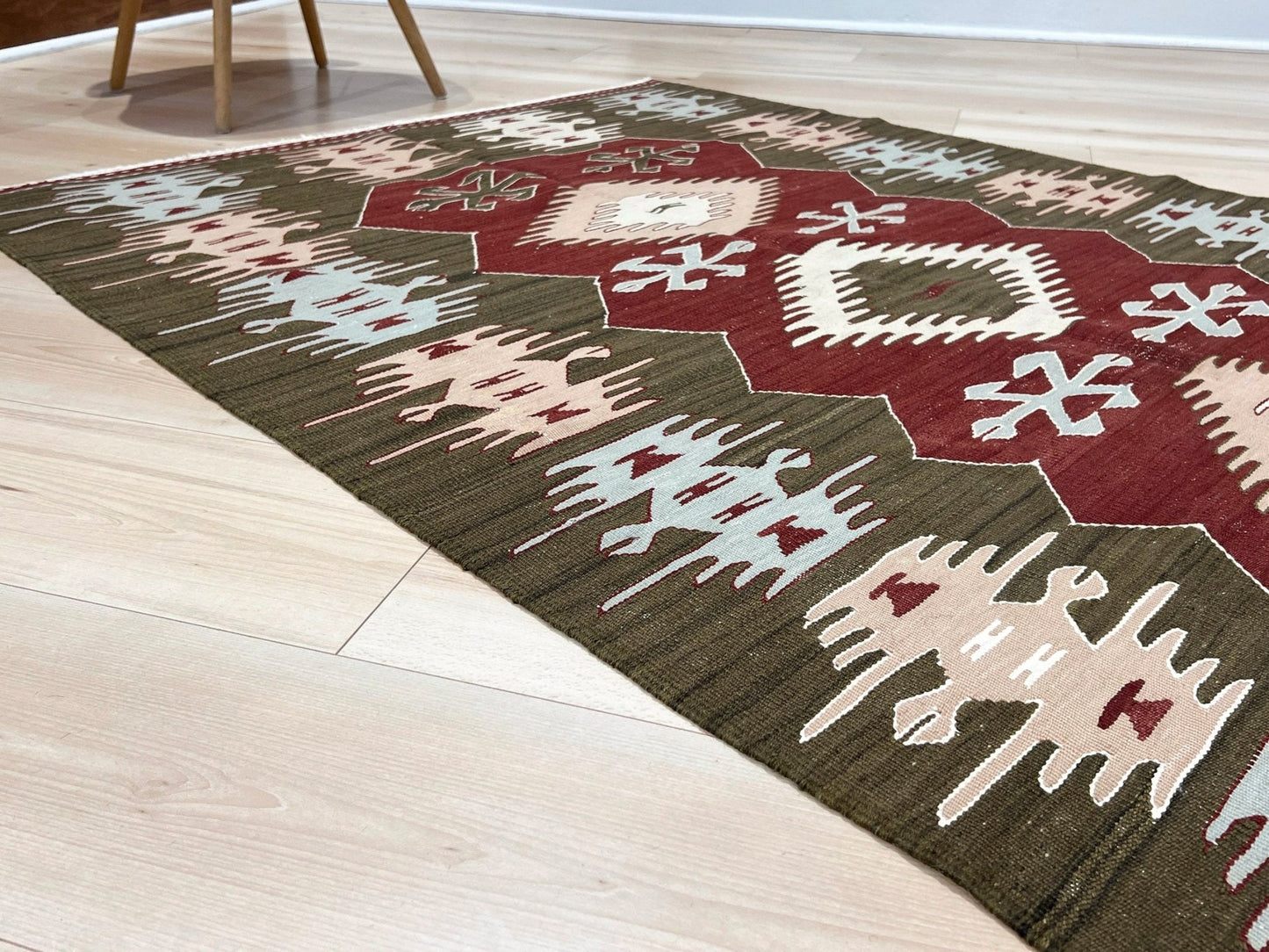 4x6 Vintage Afyon Turkish kilim flatweave rug with maroon field, olive green borders, and tribal scorpion and comb motifs — handmade wool wall hanging, available at Indigo Rugs, the best rug shop in San Francisco Bay Area, Burlingame CA.