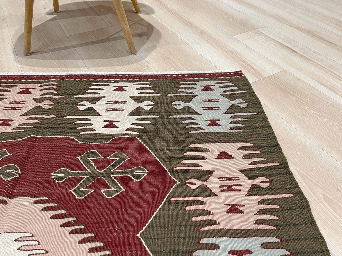 Vintage 4x6 Turkish kilim flatweave rug with maroon field, olive green borders, and tribal motifs — handmade wool wall hanging, available at Indigo Rugs, the best rug shop in San Francisco Bay Area