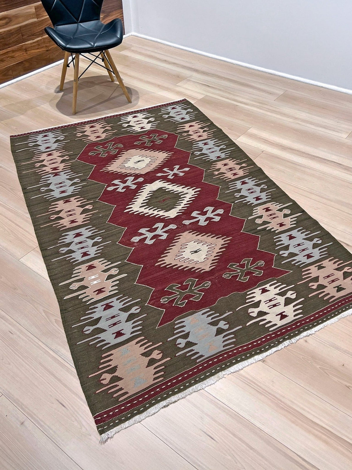 Vintage 4x6 Turkish kilim flatweave rug with maroon field, olive green borders, and tribal motifs — handmade wool wall hanging, available at Indigo Rugs, the best rug shop in San Francisco Bay Area