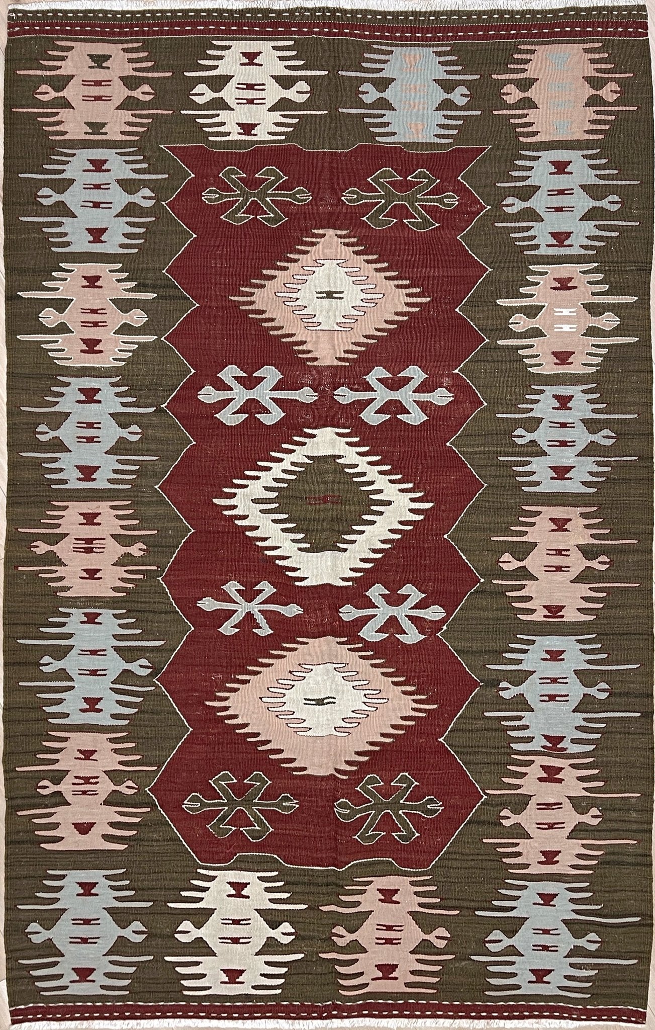 Vintage Afyon Turkish kilim flatweave rug with maroon field, olive green borders, and tribal scorpion and comb motifs — handmade wool wall hanging, available at Indigo Rugs, the best rug shop in San Francisco Bay Area, Burlingame CA.