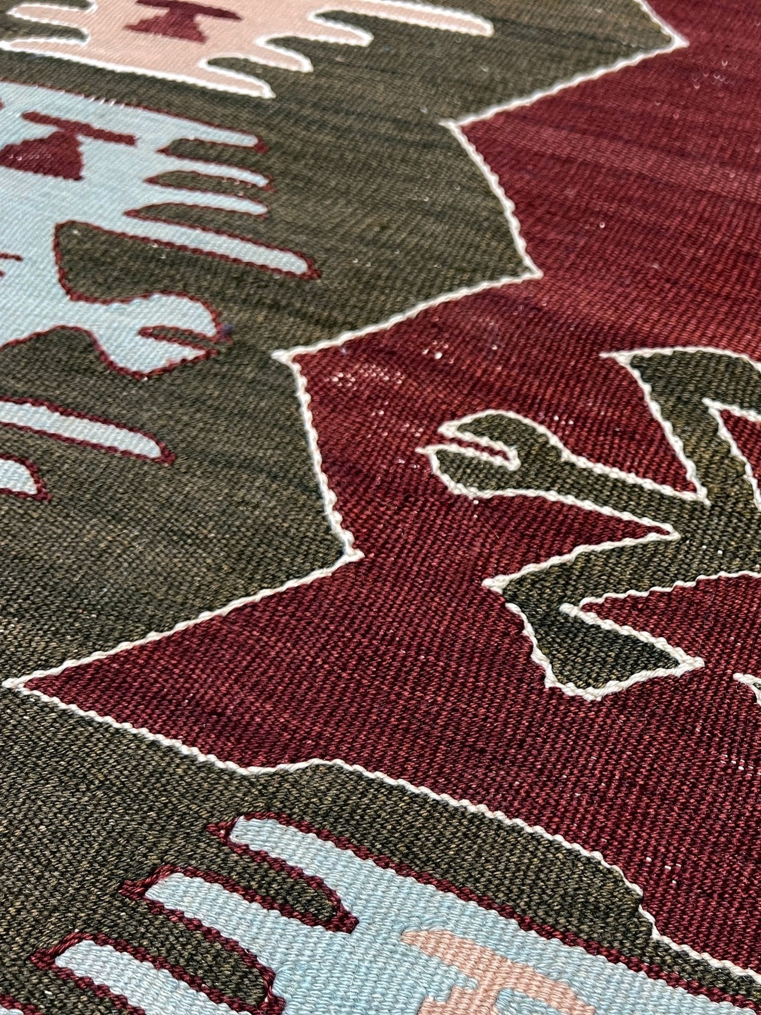 Vintage Afyon Turkish kilim flatweave rug with maroon field, olive green borders, and tribal scorpion and comb motifs — handmade wool wall hanging, available at Indigo Rugs, the best rug shop in San Francisco Bay Area, Burlingame CA.