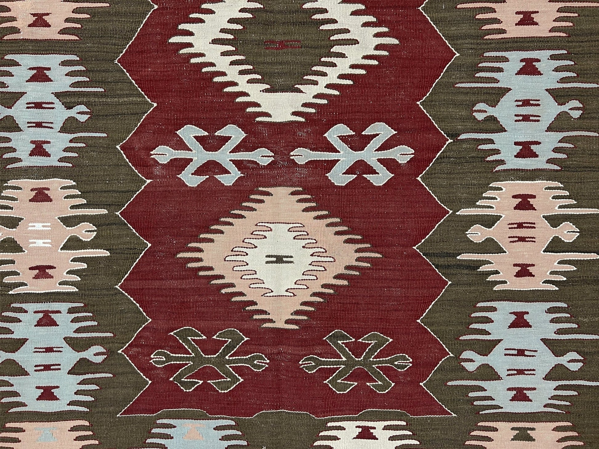 4x6 Vintage Afyon Turkish kilim flatweave rug with maroon field, olive green borders, and tribal scorpion and comb motifs — handmade wool wall hanging, available at Indigo Rugs, the best rug shop in San Francisco Bay Area, Burlingame CA.