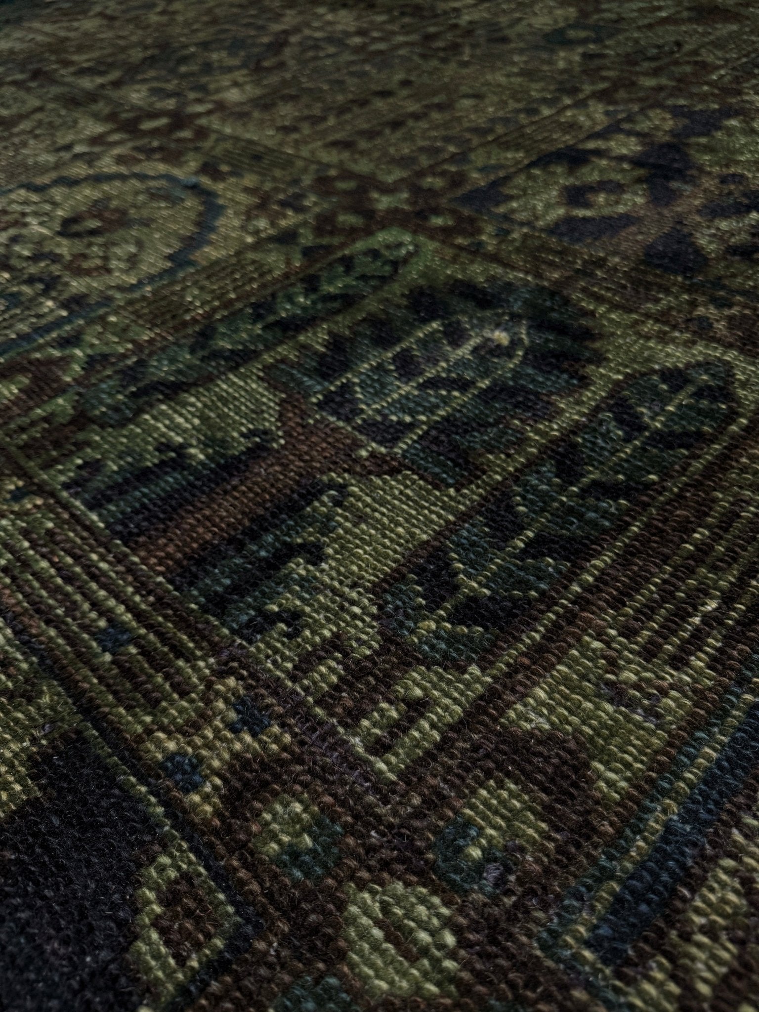 9x12 handmade overdyed Persian Bakhtiari vintage rug in deep moss green with distressed garden panel design — shown at Indigo Rugs, Burlingame — San Francisco Bay Area with free shipping