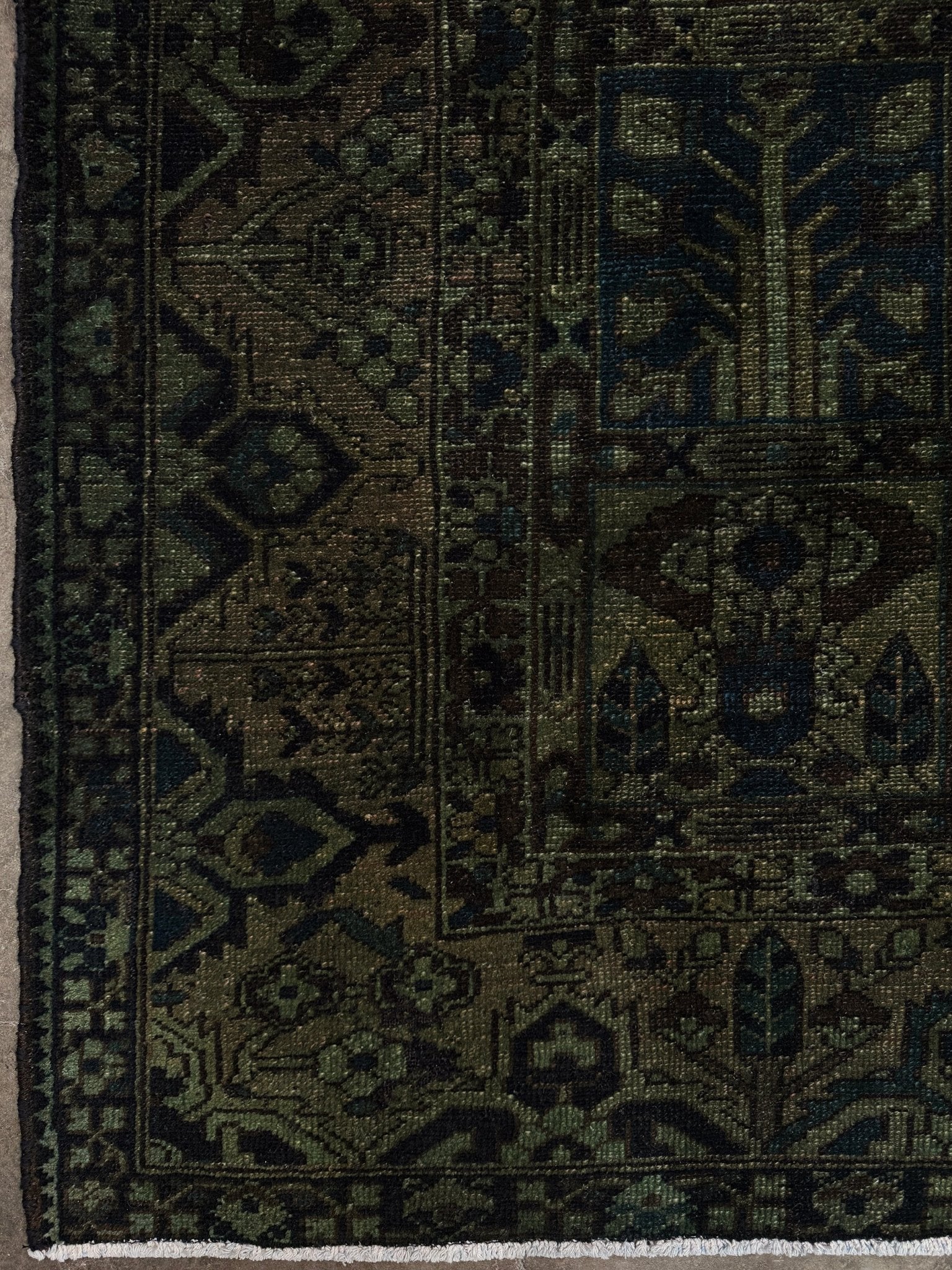 9x12 handmade overdyed Persian Bakhtiari vintage rug in deep moss green with distressed garden panel design — shown at Indigo Rugs, Burlingame — San Francisco Bay Area with free shipping