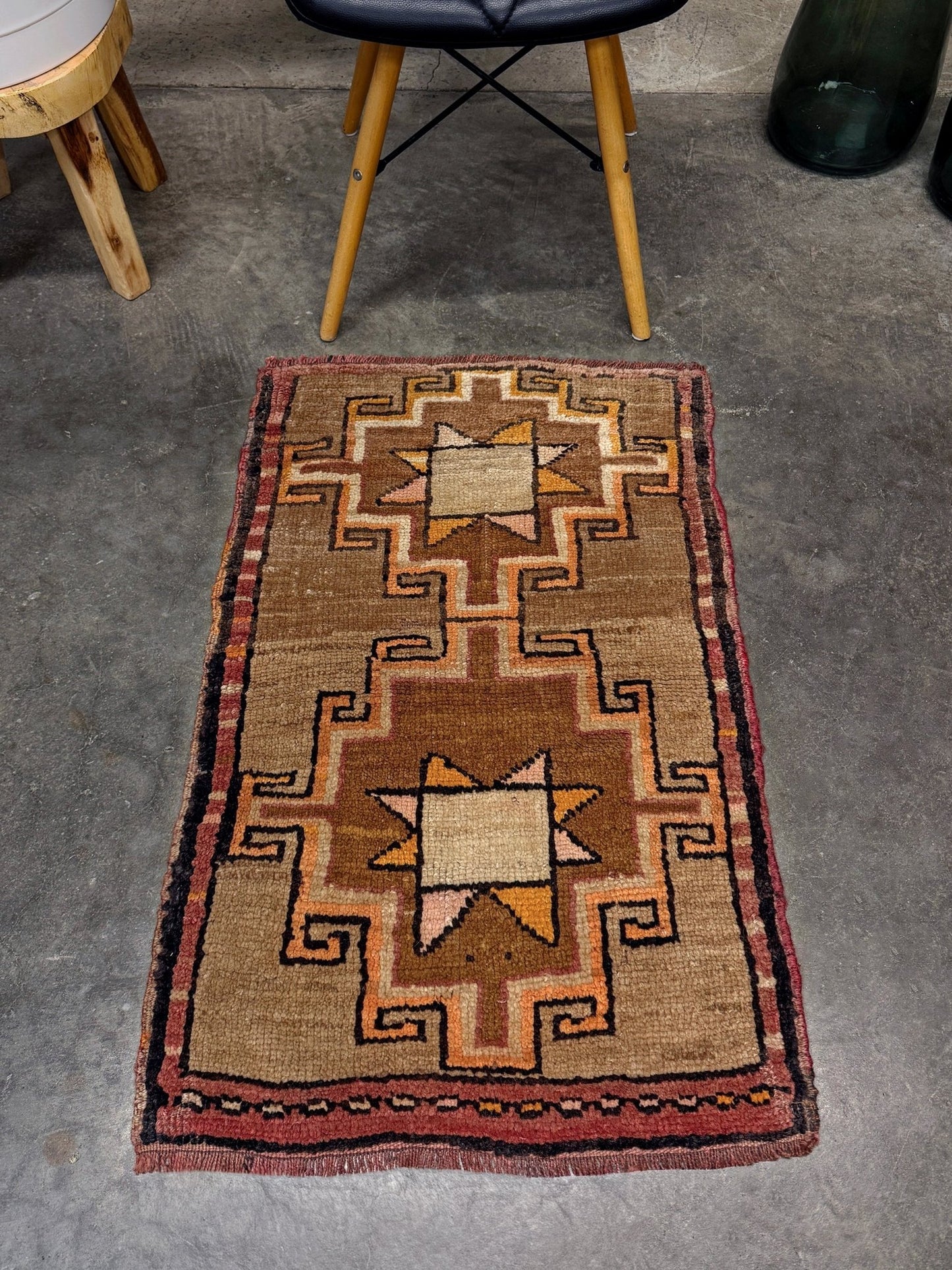 Earthy Vintage Turkish mini rug village rug with warm camel-beige field, stepped geometric star motifs, handmade wool rug measuring approximately 21 x 33 inches. From the best rug shop in SF Bay Area Burlingaöe CA. Free Shipping.