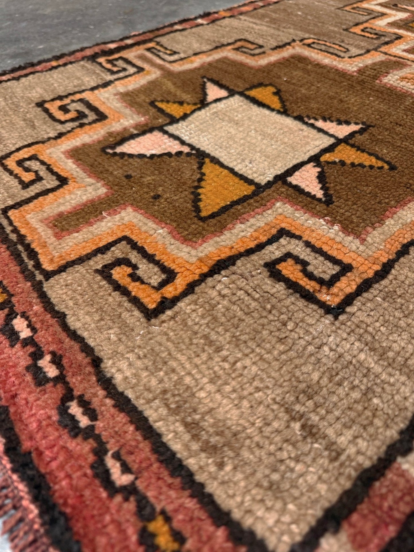 Earthy Vintage Turkish mini rug village rug with warm camel-beige field, stepped geometric star motifs, handmade wool rug measuring approximately 21 x 33 inches. From the best rug shop in SF Bay Area Burlingaöe CA. Free Shipping.