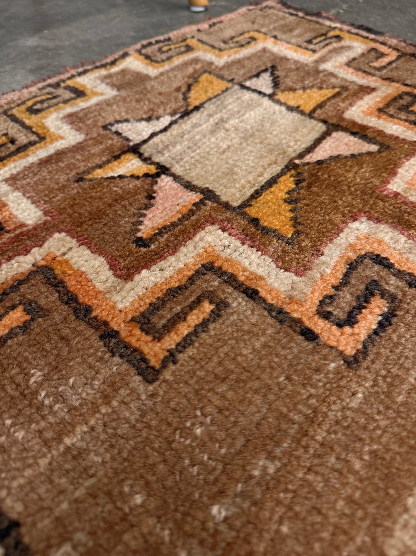 Earthy Vintage Turkish mini rug village rug with warm camel-beige field, stepped geometric star motifs, handmade wool rug measuring approximately 21 x 33 inches. From the best rug shop in SF Bay Area Burlingaöe CA. Free Shipping.